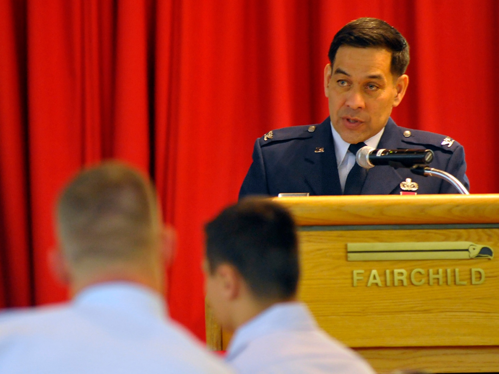 Col. Steve Asher, former 341st Security Forces Group commander, Malmstrom Air Force Base, Mont., speaks to 92nd Security Forces Airmen and civilian police forces about remembering and honoring heroes who have fallen in the line of duty, during a National Police Week breakfast at Club Fairchild May 11. (U.S. Air Force photo / Airman 1st Melissa L. Carlino)