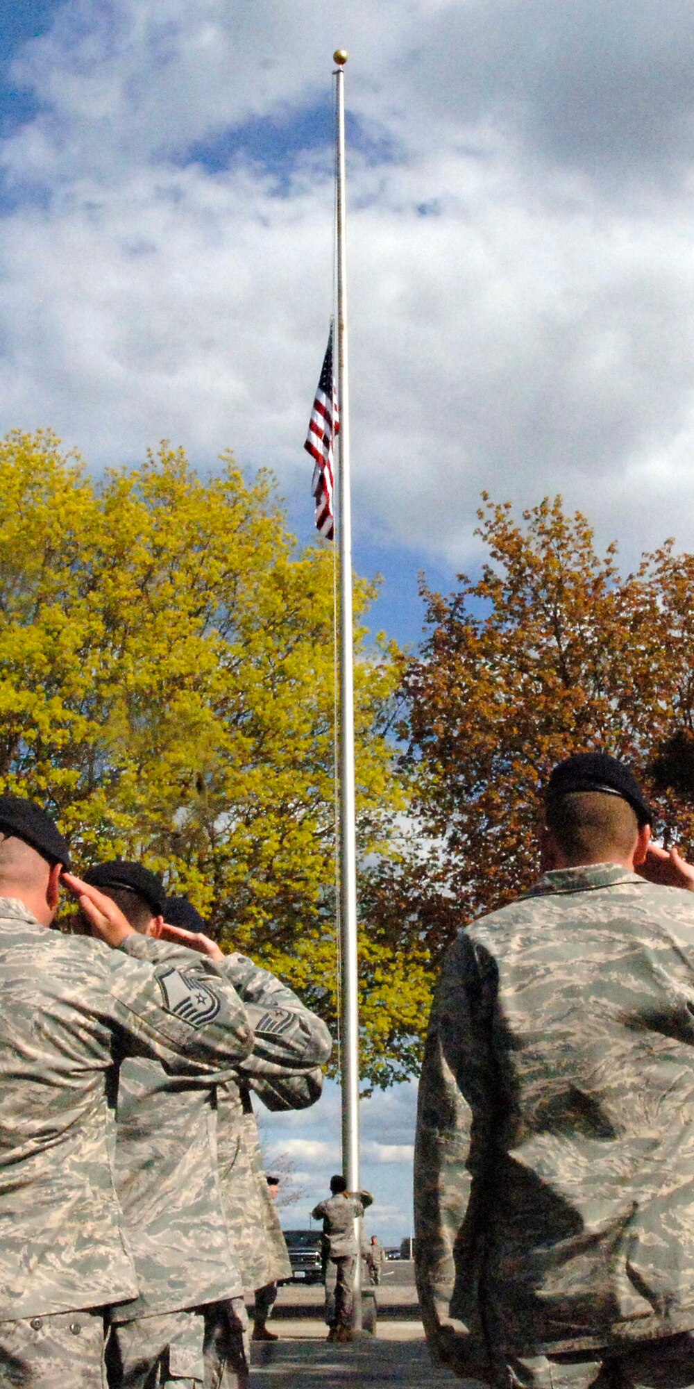 The 92nd Security Forces Squadron performs Retreat in honor of National Fallen Heroes week in front of the 92nd Air Refueling Wing Headquarters, May 15. (U.S. Air Force photo / Airman 1st Class Melissa L. Carlino)