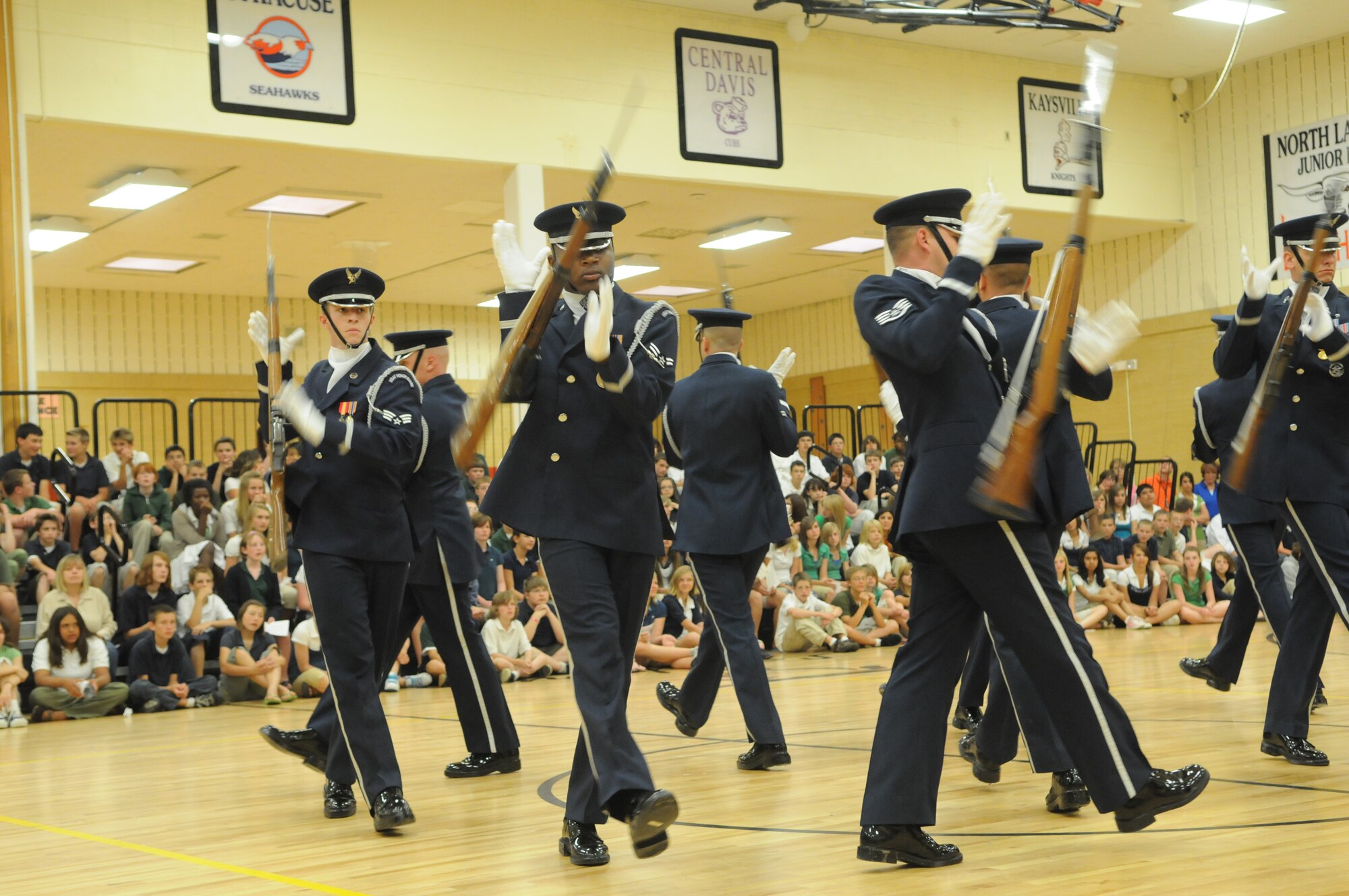 The United States Air Force Honor Guard Drill Team performs a series of complex maneuvers June 4 in front of students and faculty from North Layton Junior High School, Salt Lake City, as part of Air Force Week. Air Force Weeks are held all around the country every year and allow community members the chance to learn about the Air Force mission and interact with Airmen on a one-on-one basis.
 (U.S. Air Force photo by Senior Airman Sean Adams)