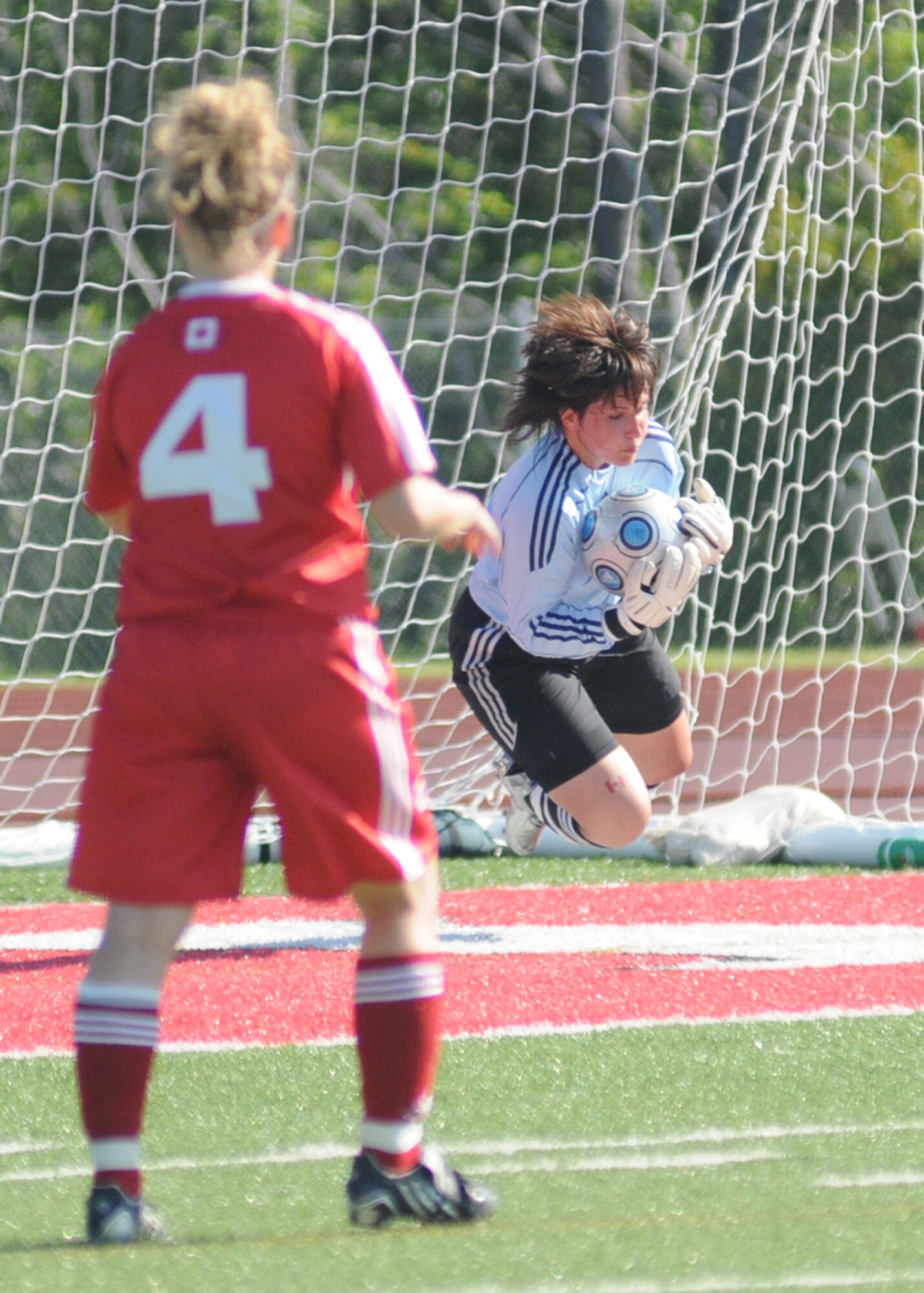 Canada and France compete during the 5th CISM Women’s Soccer Championship at Biloxi High School Stadium 7 June.  The CISM tournament, hosted by Keesler Air Force Base, includes teams from Brazil, Canada, France, Germany, The Netherlands, The Republic of South Korea and the United States.  Matches are being held June 6 to 13, with the Gold match June 13 at 2 p.m.  Organizers say the tournament gives teams and people who attend a chance to develop bonds and life-long friendships between the countries and a chance to learn about one another’s cultural similarities and differences.  (U.S. Air Force photo by Kemberly Groue)