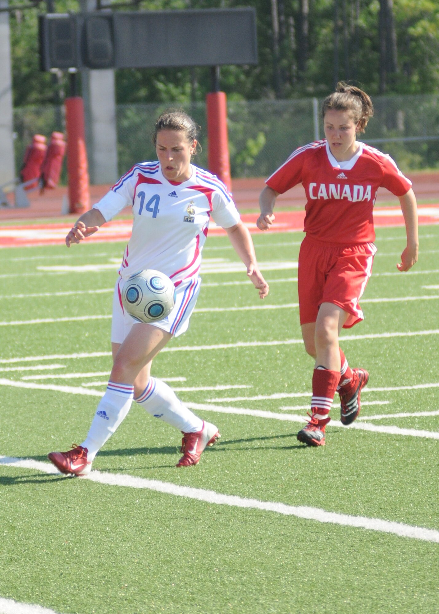 Canada and France compete during the 5th CISM Women’s Soccer Championship at Biloxi High School Stadium 7 June.  The CISM tournament, hosted by Keesler Air Force Base, includes teams from Brazil, Canada, France, Germany, The Netherlands, The Republic of South Korea and the United States.  Matches are being held June 6 to 13, with the Gold match June 13 at 2 p.m.  Organizers say the tournament gives teams and people who attend a chance to develop bonds and life-long friendships between the countries and a chance to learn about one another’s cultural similarities and differences.  (U.S. Air Force photo by Kemberly Groue)