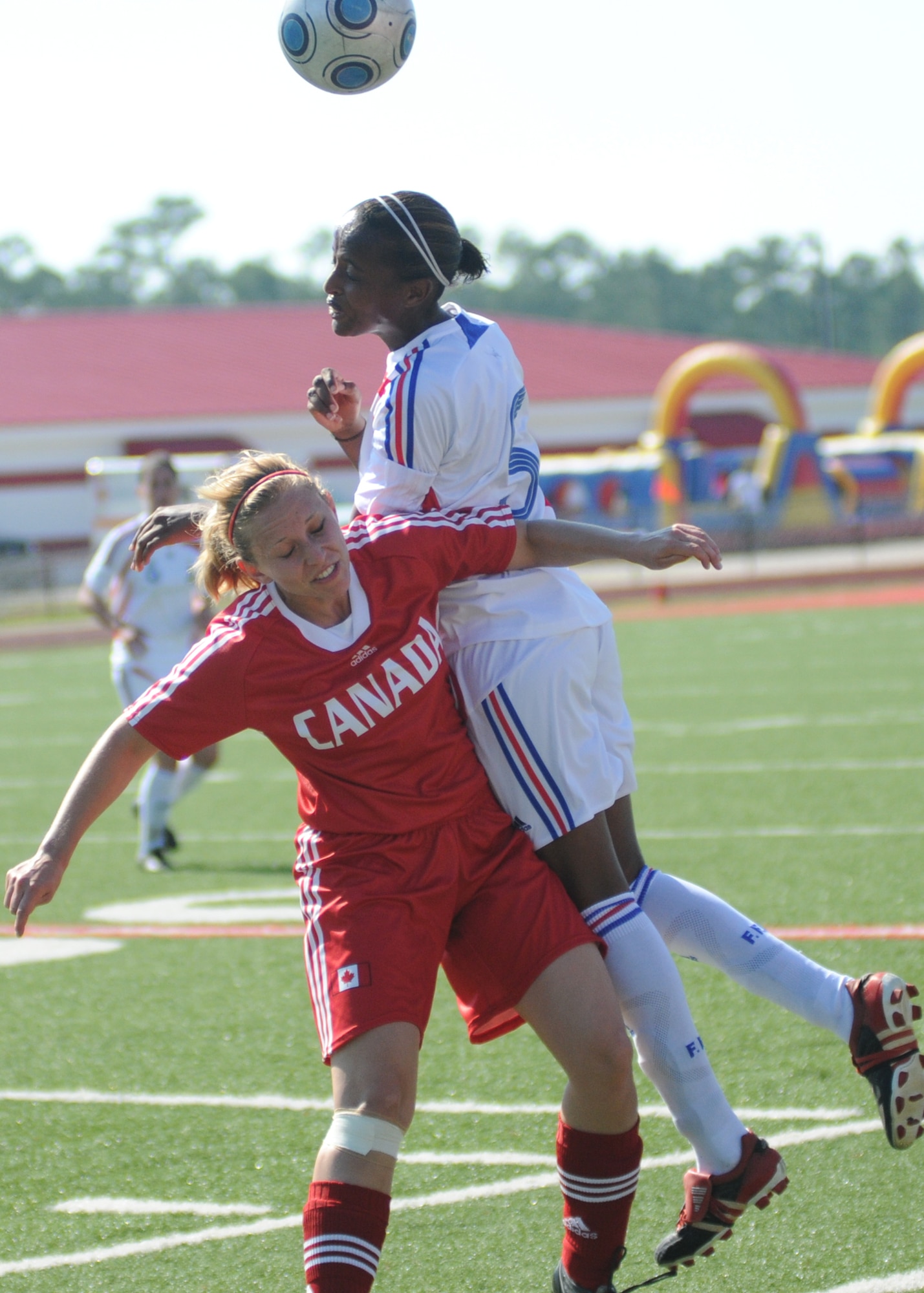 Canada and France compete during the 5th CISM Women’s Soccer Championship at Biloxi High School Stadium 7 June.  The CISM tournament, hosted by Keesler Air Force Base, includes teams from Brazil, Canada, France, Germany, The Netherlands, The Republic of South Korea and the United States.  Matches are being held June 6 to 13, with the Gold match June 13 at 2 p.m.  Organizers say the tournament gives teams and people who attend a chance to develop bonds and life-long friendships between the countries and a chance to learn about one another’s cultural similarities and differences.  (U.S. Air Force photo by Kemberly Groue)