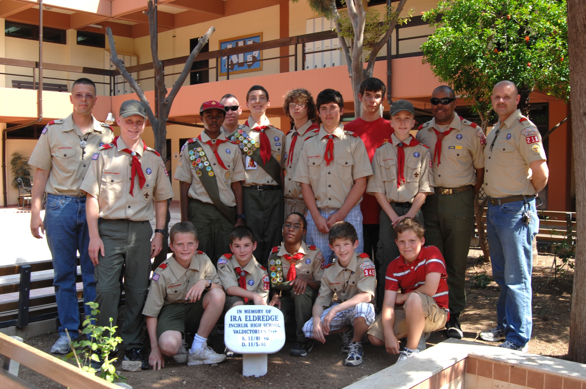 Members of Boy Scout troop 218 pose by the Ira Eldridge memorial marker Wednesday, June 3, 2009 after the Ira Eldridge Memorial Re-dedication Ceremony at Incirlik Unit School, Incirlik Air Base, Turkey. The troop honored the memory of Eagle Scout Eldridge who died in 2001 of leukemia. Ira Eldridge was also the class of 1999 valedictorian at Incirlik Unit School, vice president of the Incirlik Unit School National Honor Society and a member of the varsity soccer team. A memorial plaque was placed on school grounds, but fell into disrepair over the years. The scouts decided it needed to be resurrected and placed in a more prominent location so current and future generations would not forget him. (U.S. Air Force photo/ Staff Sgt. Lauren Padden)