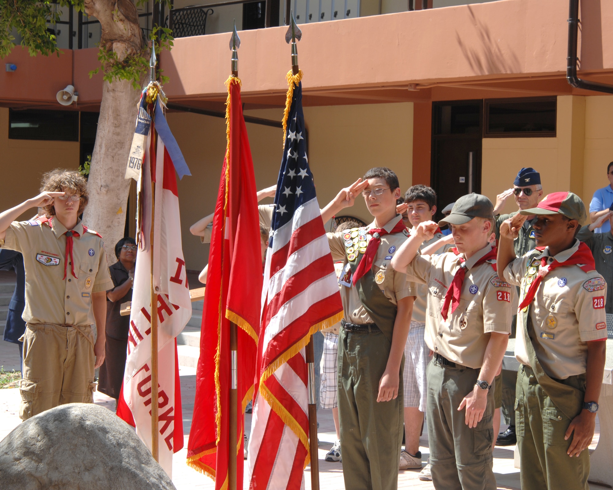 Members of Boy Scout troop 218, as well as an on looking crowd salute the colors Wednesday, June 3, 2009 during the Ira Eldridge Memorial Re-dedication Ceremony at Incirlik Unit School, Incirlik Air Base, Turkey. The troop honored the memory of Eagle Scout Eldridge who died in 2001 of leukemia. Ira Eldridge was also the class of 1999 valedictorian at Incirlik Unit School, vice president of the Incirlik Unit School National Honor Society and a member of the varsity soccer team. A memorial plaque was placed on school grounds, but fell into disrepair over the years. The scouts decided it needed to be resurrected and placed in a more prominent location so current and future generations would not forget him. (U.S. Air Force photo/ Staff Sgt. Lauren Padden)