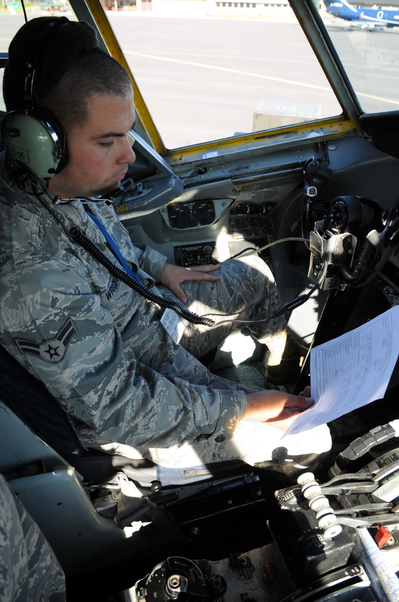 Airman 1st Class Josh Wright, 100th Aircraft Maintenance Squadron, performs pre-flight checks aboard a 100th Air Refueling Wing KC-135 before the first mission of Loyal Arrow 2009 in Lulea, Sweden.  Loyal Arrow is an exercise in Sweden involving more than 10 countries and 1,000 military members.  (U.S. Air Force photo by Staff Sgt. Austin M. May)  
