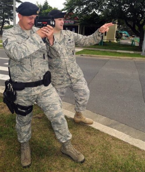 MISAWA AIR BASE, Japan -- Staff Sgts. Joshua Archibald and Ross List, 35th Security Forces Squadron patrolmen, conduct laser identification detection and ranging training June 5, 2009, on Freedom Lane. Security forces train their Airmen on this system every Friday. The LIDAR system is used to catch people breaking Misawa’s speed limit. (U.S. Air Force photo by Staff Sgt. Phillip Butterfield)