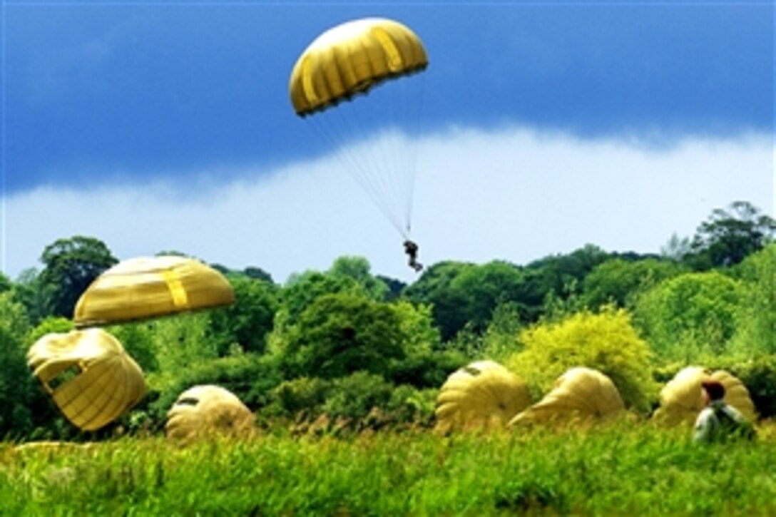 U.S. Army soldiers re-enact the D-Day paratrooper jump that occurred 65 years ago over Saint Mere Eglise, France, June 7, 2009.