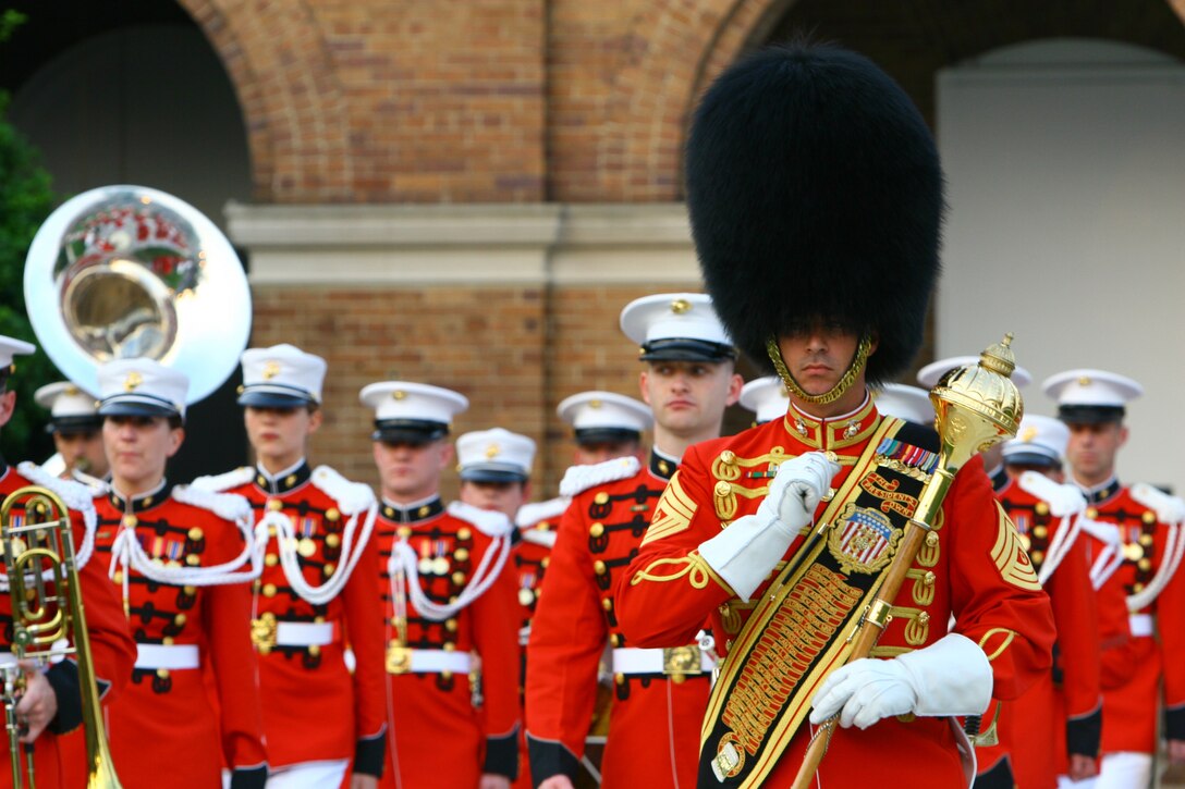 Master Sgt. Kevin Browne, U.S. Marine Band drum major, leads the unit during a performance at the honor ceremony of the Brigadier General Select Orientation Conference at Marine Barracks Washington, June 8.  Official Marine Corps Photo by Cpl. Jacob H. Harrer