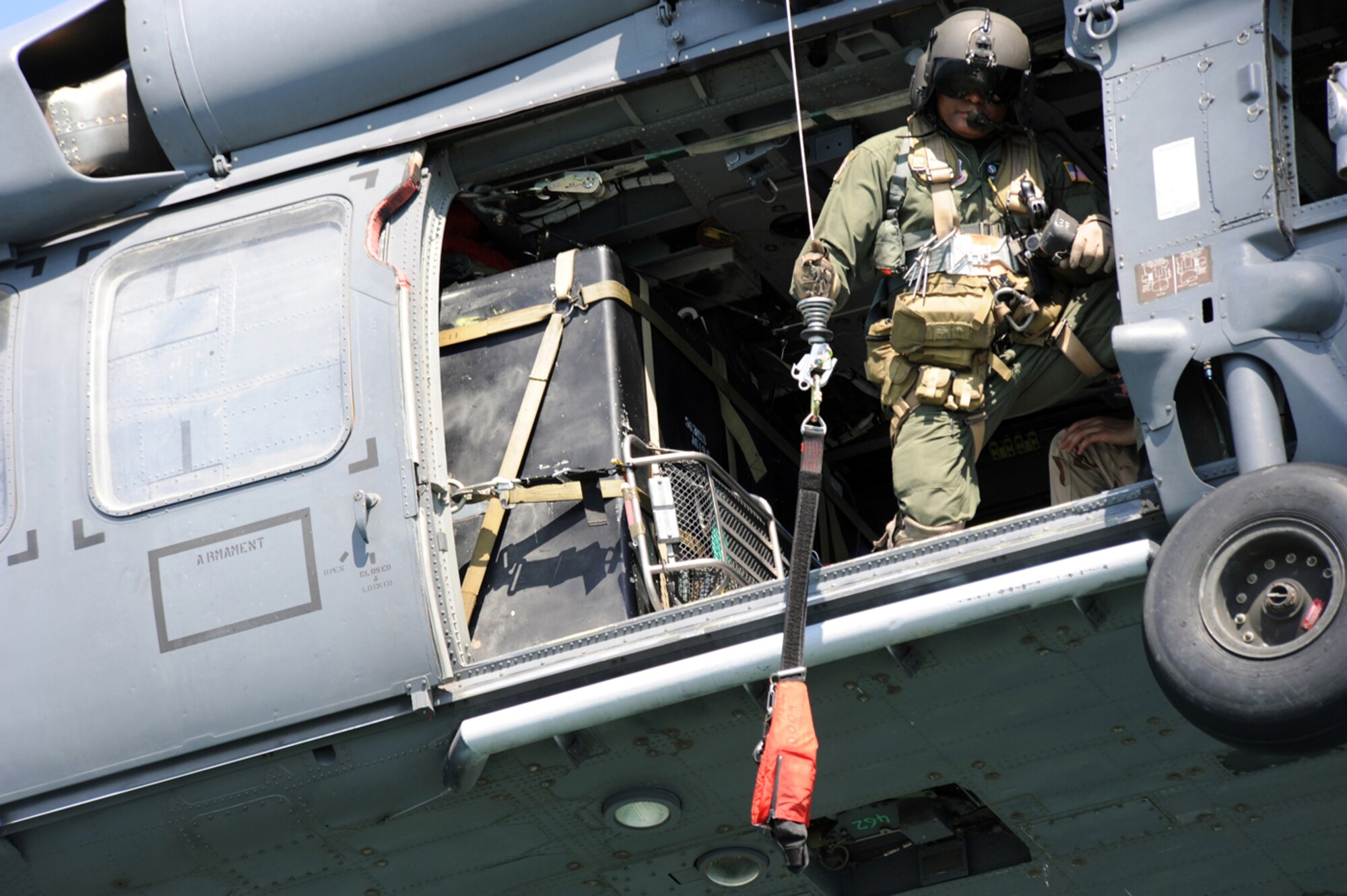 Chief Master Sgt. Kenneth Price of the 563rd Rescue Group prepares to lower the hoist to a pararescue Airman during Exercise Resolute Angel. The exercise, hosted by Laughlin Air Force Base, Texas, was conducted May 29 to June 4 in preparation for the upcoming hurricane season. (U.S. Air Force Photo/Master Sgt. Heather Cabral)
