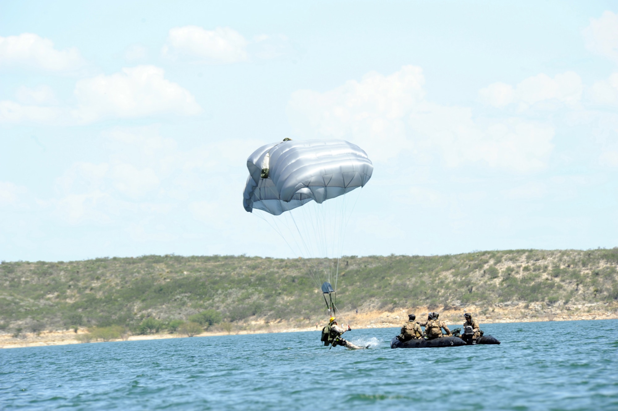 Staff Sgt. Michael Flores of the 48th Rescue Squadron enters the water to meet his fellow pararescue Airmen after jumping out of an HC-130P Hercules during Exercise Resolute Angel. The exercise, hosted by Laughlin Air Force Base, Texas, was conducted May 29 to June 4 in preparation for the upcoming hurricane season. (U.S. Air Force Photo/Master Sgt. Heather Cabral)