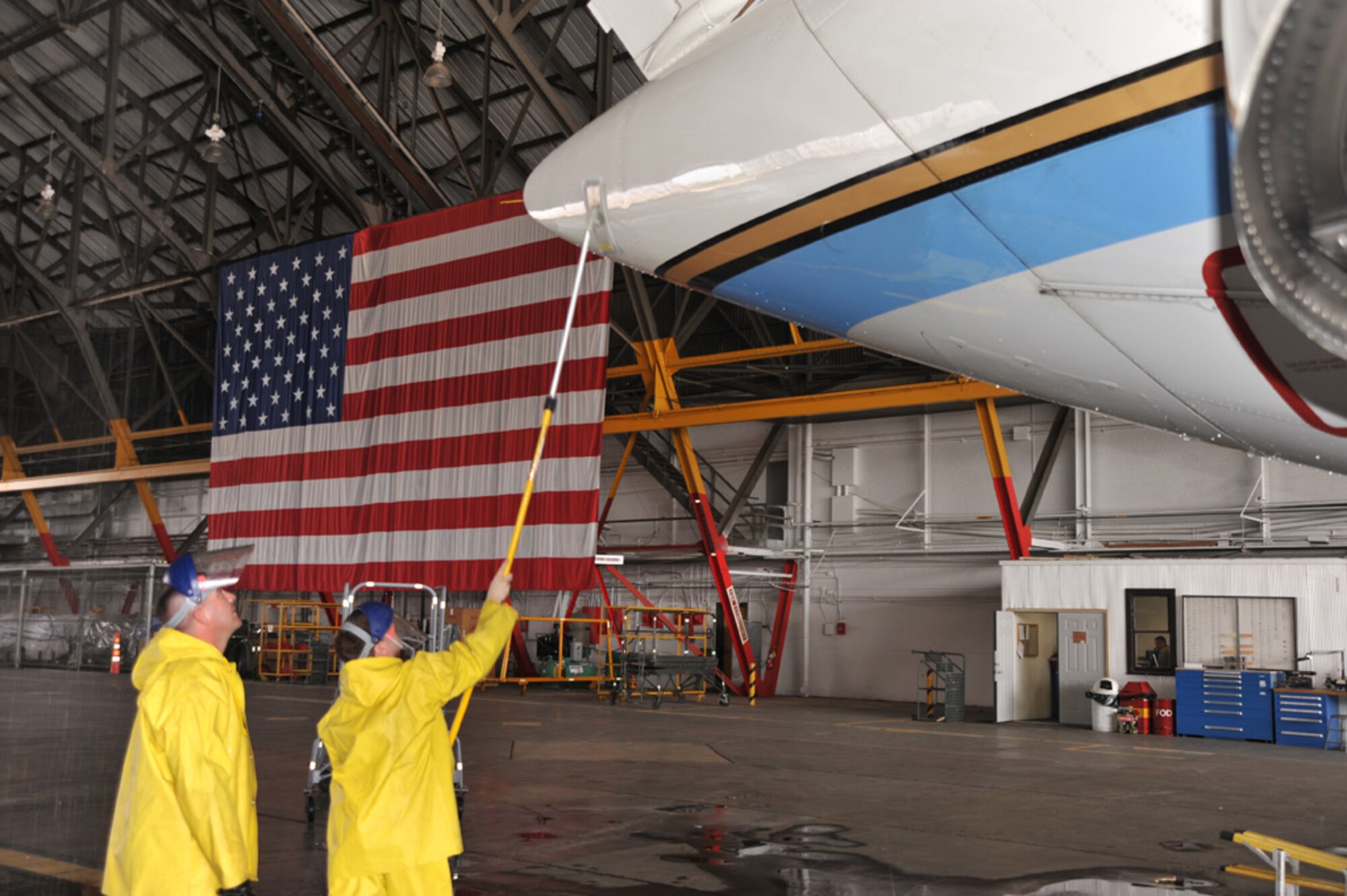 932nd Airlift Wing maintainers clean the tail of a unit plane inside Hangar One.  The wing flies the C-40C and C-9C aircraft.  The next drill weekend is June 13-14 at Scott Air Force Base, Ill.  (U.S. Air Force photo/Tech. Sgt. Dan Oliver)