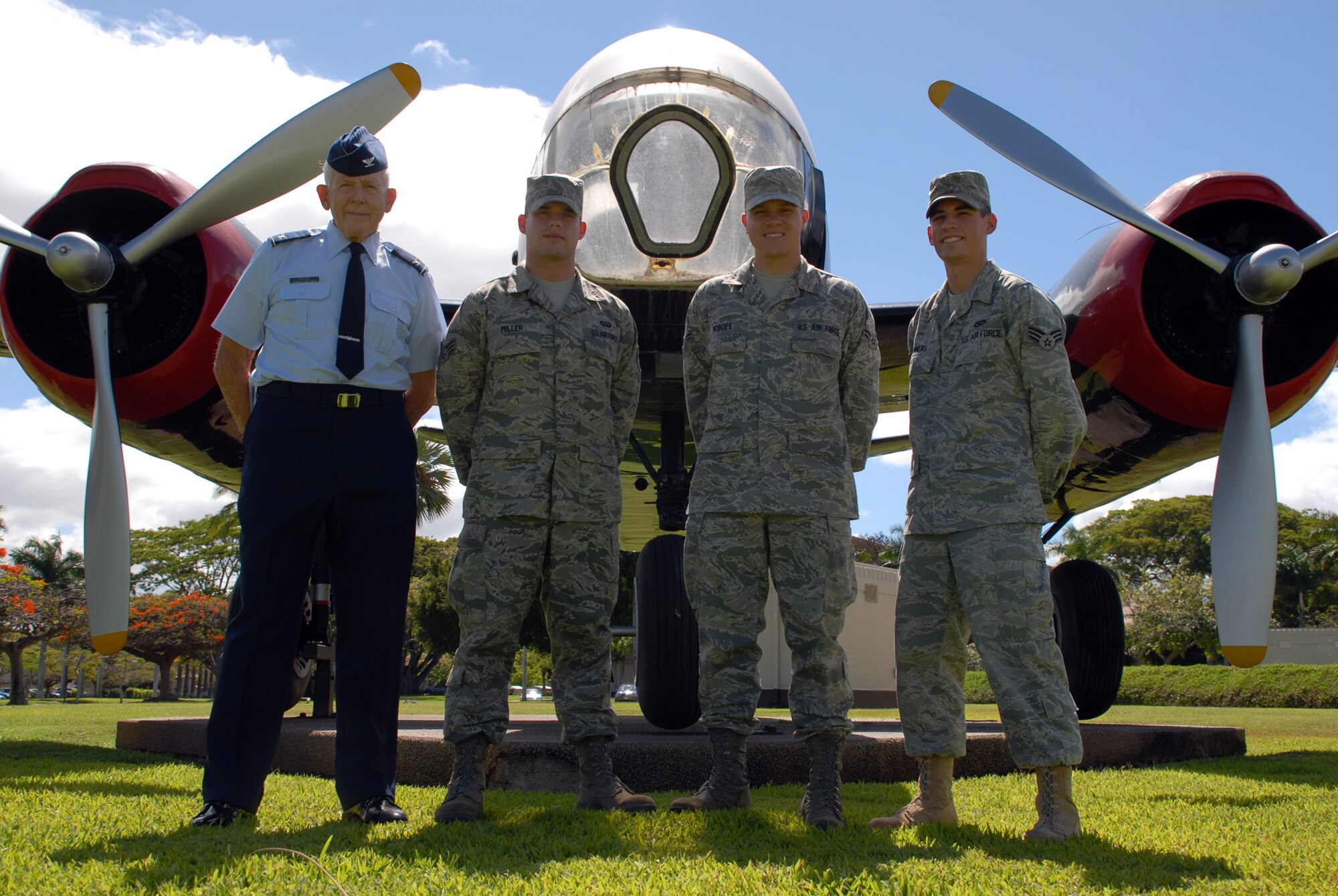 HICKAM AIR FORCE BASE, Hawaii -- Col. Lawrence Roller, the Hickam Air Force Base Air Force Academy admission liaison officer, stands with three Airmen from base who were accepted to the Colorado Springs, Co., academy and are scheduled to depart Hawaii to begin classes in the fall. Next to Colonel Roller, left to right, are Senior Airman Adam Miller, 8th Intelligence Squadron imagery analyst, Airman 1st Class Jason Hodges, Det-1 561st Network Operations Squadron network infrastructure technician, and Senior Airman Keaton Hinners, 15th Civil Engineer Squadron engineer assistant. Airmen Hodges and Miller will attend preparatory school, and Airman Hinners will be a freshman at the academy. According to the AFA Web site, www.usafa.af.mil, the Academy sets aside up to 85 slots for active-duty Airmen and up to 85 more slots for Guard and Reserve members in each cadet class. Additionally, the prep school offers 60 slots for Airmen to join the one-year program, after which graduates will enter into the Academy's next class of cadets. For more information on how to apply for any of these programs, call Colonel Roller at 623-2178 or visit the base education office. (U.S. Air Force photo/Senior Airman Carolyn Viss)
