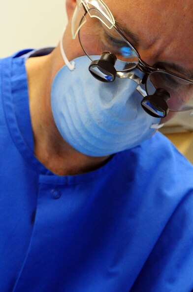 BARKSDALE AIR FORCE BASE, La. -- A resident in the advanced education in general dentistry program fills the cavity of a patient at the 2d Dental Squadron clinic, June 5. (U.S Air Force photo by Senior Airman Joanna M. Kresge)