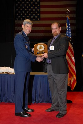 Gen. Norton A. Schwartz, Air Force Chief of Staff, presents Joe Orr, 3rd Wing historian, the John R. Burton Award at Wright Patterson Air Force Base, Ohio, May 13. The John R. Burton Award is given biennial to the best history office in the Air Force. (Courtesy photo) 