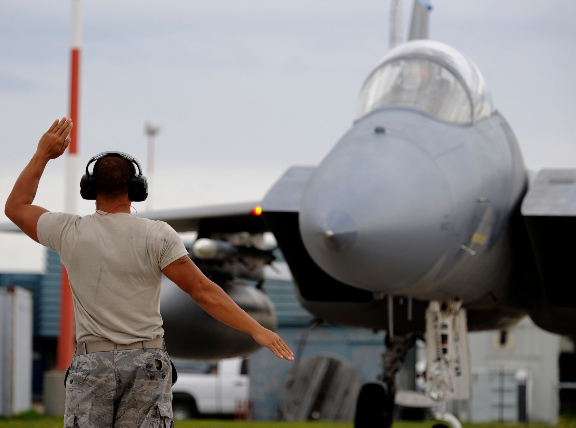 WING COLD LAKE, Alberta - Staff Sgt. Malik Coleman, 390th Aircraft Maintenance Unit F-15C Eagle crew chief, marshals in Capt. Rich Stocker during the arrival of the 390th Fighter Squadron to participate in exercise Maple Flag 42 at Wing Cold Lake, Alberta, May 30. Maple Flag is a Canadian-sponsored and Air Combat Command supported exercise providing aircrews simulated air and ground combat training to coalition forces in a NATO environment. (U.S. Air Force photo/Senior Airman Larry E. Reid Jr.)