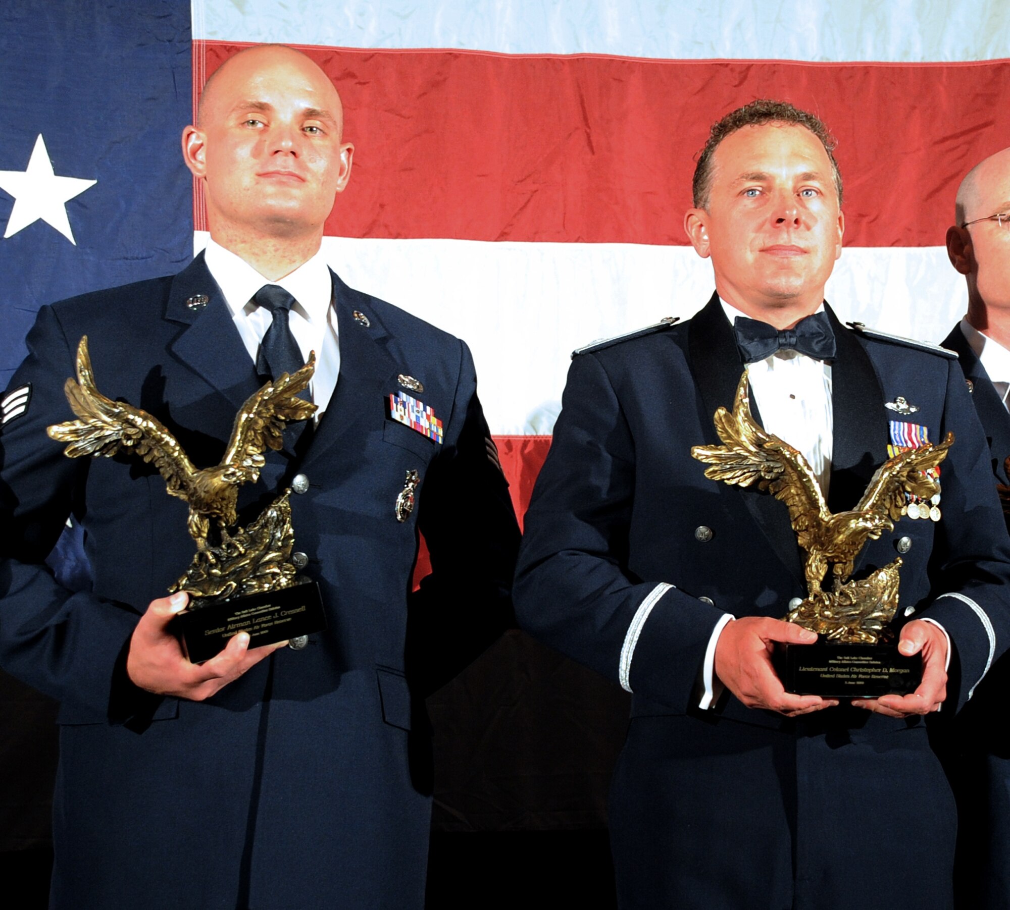 Senior Airman Lance Cressall, 419th Security Forces Squadron, and Lt. Col. Chris Morgan, 419th Operations Support Flight, were honored at the Military Salute Banquet hosted by the Salt Lake Chamber Military Affairs Committee June 2. The Chamber hosts the event annually to shine the spotlight on Utah’s reservists and guardsmen, and also to promote an understanding between military members and the community in which they serve. (U.S. Air Force photo/Alex Lloyd)