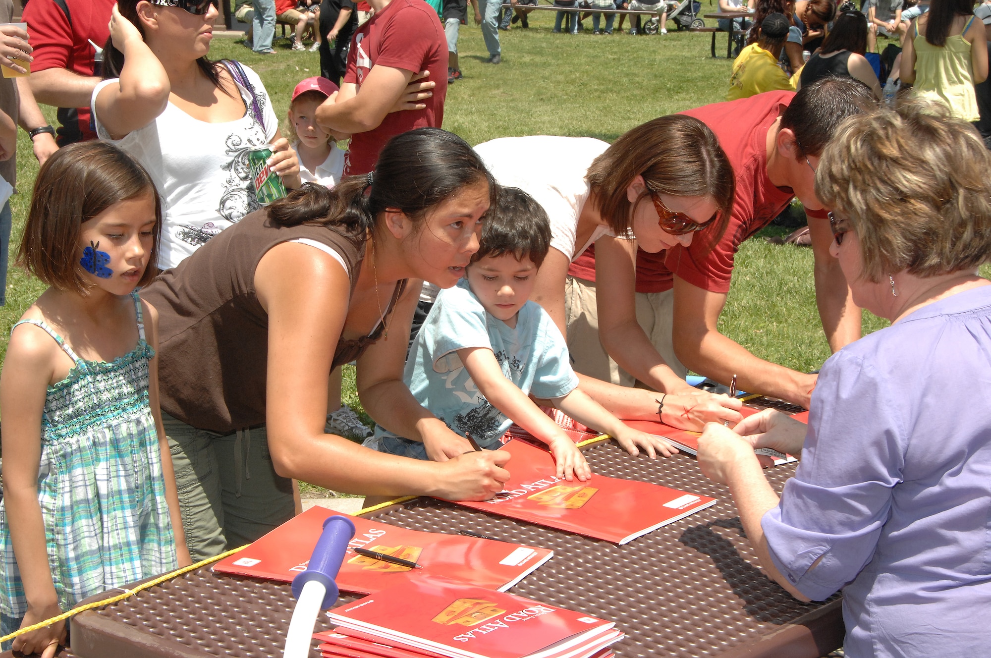OFFUTT AIR FORCE BASE, Neb. -- Members of the Offutt community sign up for a raffle during the 15th annual Offutt Appreciation Picnic at the Base Lake June 5. Several prizes were raffled off including 11 bicycles, gift certificates to local restaraunts and a big screen television..U.S. Air Force Photo by D.P. Heard