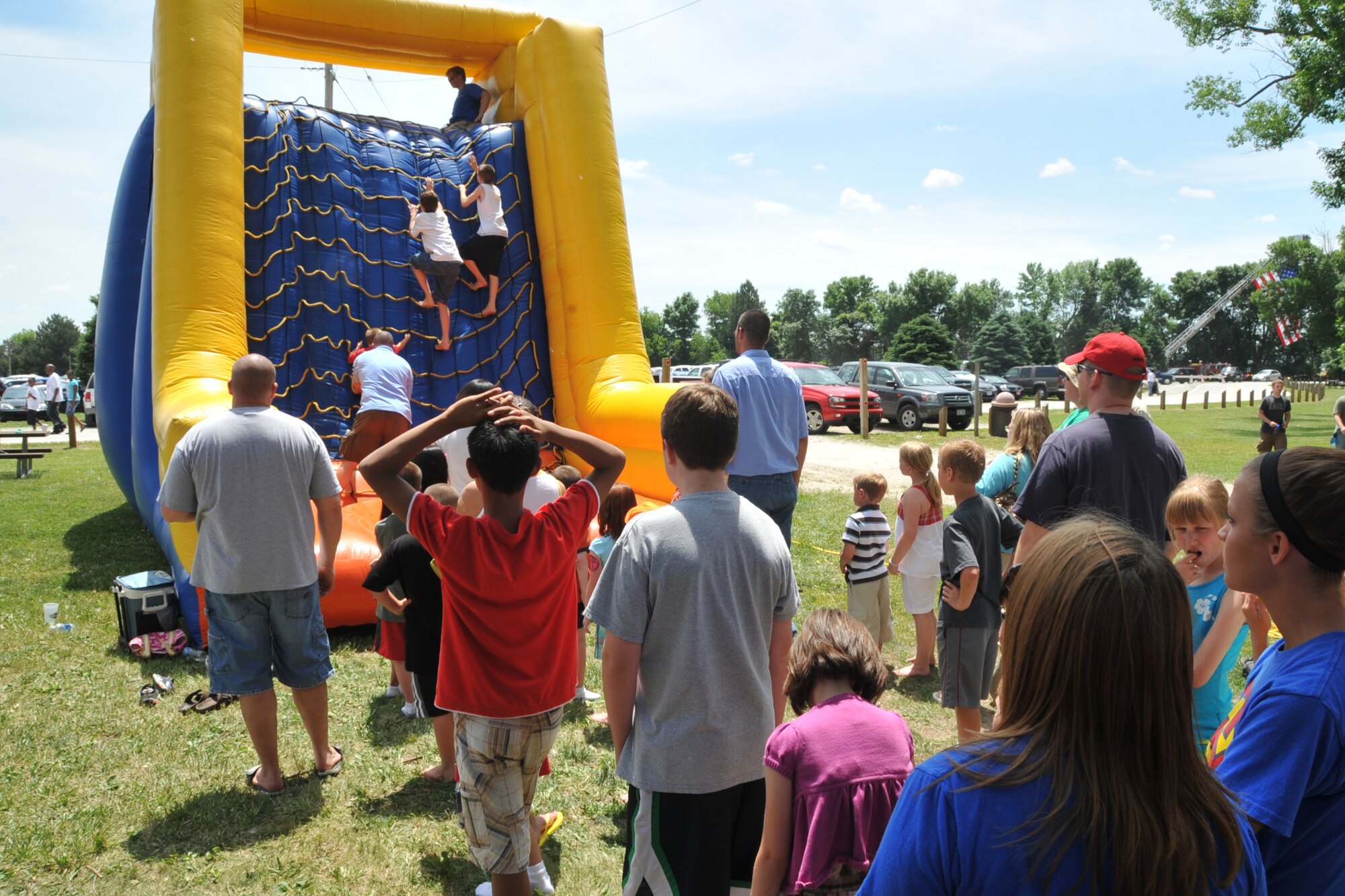 OFFUTT AIR FORCE BASE, Neb. -- Several children wait in line to climb up an inflateable slide during the 15th annual Offutt Appreciation Picnic at the Base Lake June 5. Picnic goers also enjoyed free food, live entertainment and prize giveaways. U.S. Air Force photo by Jeff W. Gates
