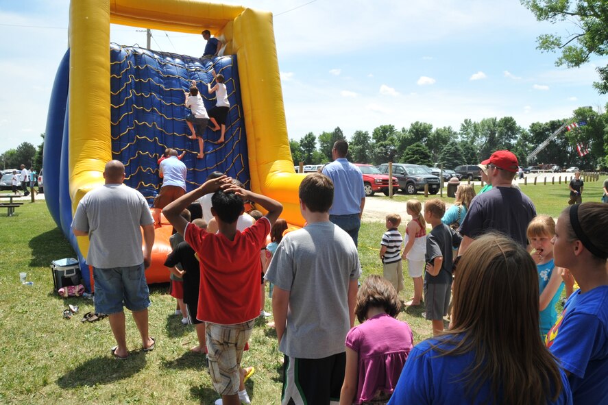 OFFUTT AIR FORCE BASE, Neb. -- Several children wait in line to climb up an inflateable slide during the 15th annual Offutt Appreciation Picnic at the Base Lake June 5. Picnic goers also enjoyed free food, live entertainment and prize giveaways. U.S. Air Force photo by Jeff W. Gates