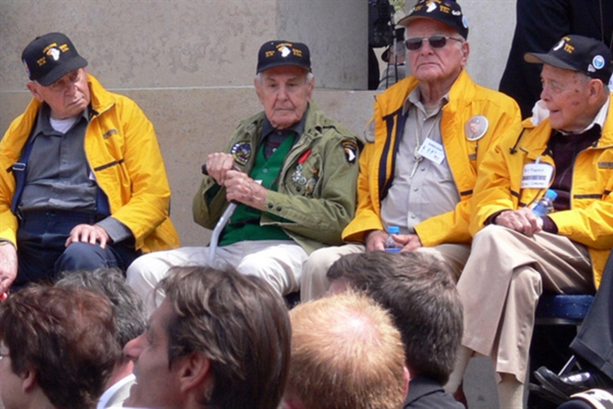 Surviving members of the famed Easy Company, 2nd Battalion, 506th Parachute Infantry Regiment, participate in a ceremony honoring the 65th anniversary of D-Day, at the Normandy American Cemetery and Memorial on June 6. The group was part of more than two dozen D-Day veterans honored in ceremonies across the Normandy region. (U.S. Army Photo/Bill Roche)  
