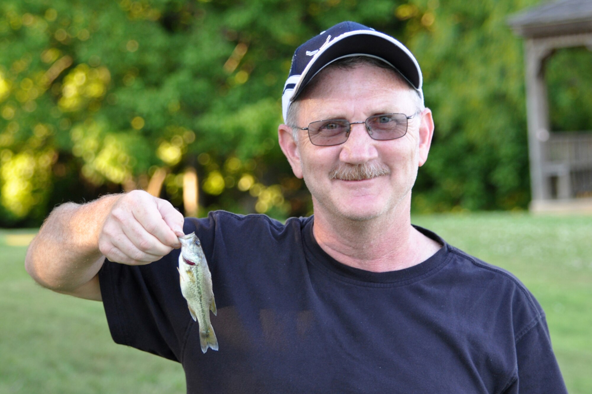 Technical Sgt. Jeff Walston, 917th Wing, public affairs technician, prepares to hydrate after an extended “tug of war” with what he claims is the “much more aggressive Florida Bass” at a Shreveport, La., lake June 8, 2009. Sergeant Walston, who is an accomplished angler, remembers the Air Force chief of staff launching the service’s annual Critical Days of Summer safety campaign which began May 22. Air Force safety is no accident, and Sergeant Walston has plans to minimize the chance of accidental death and injury to him and others during his summer activities as well as emphasizing the importance of safety at his workplace.  (Courtesy photo)