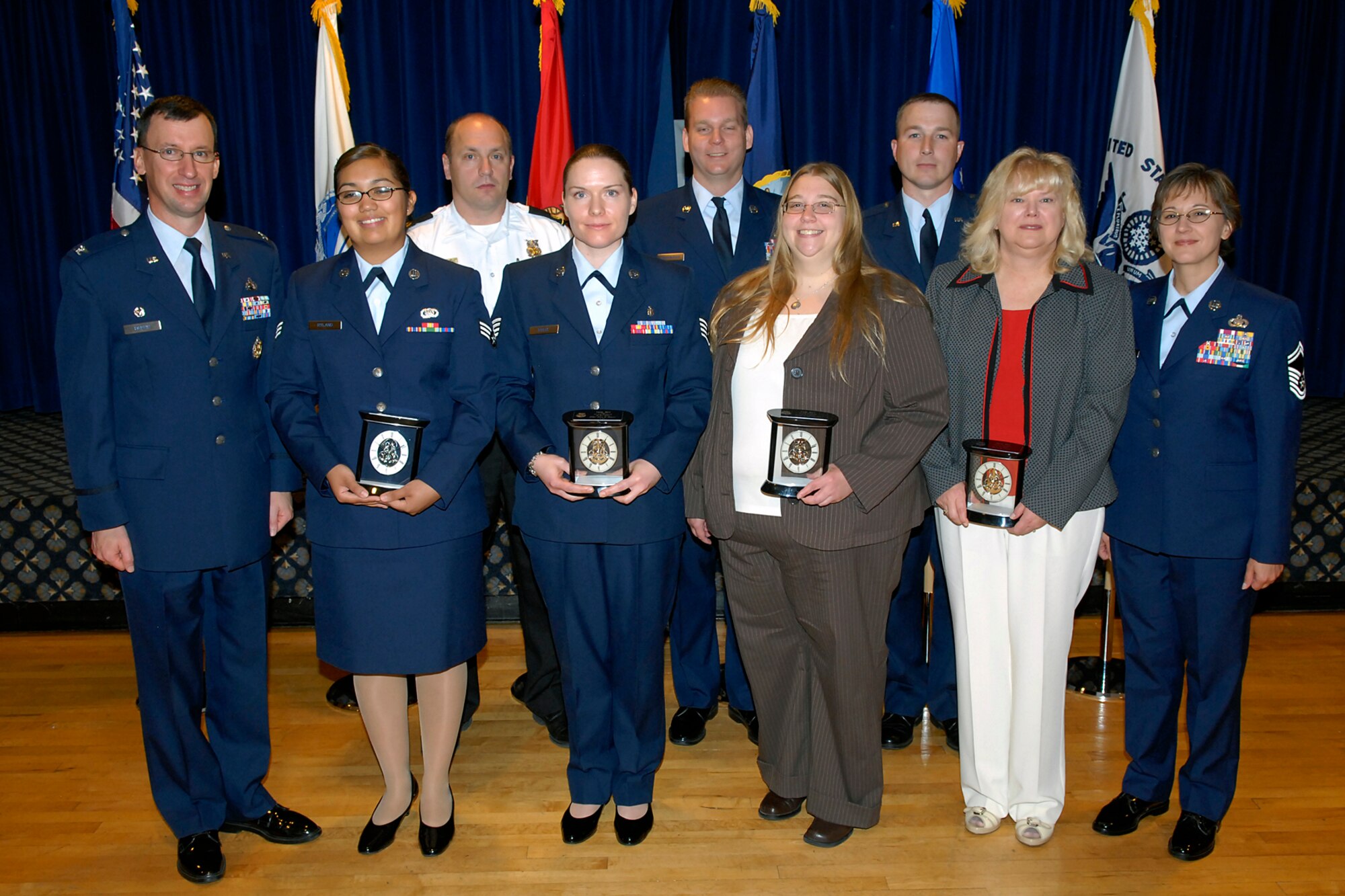 The Team Pete First Quarter 2009 award winners were announced June 5 at The Club. They are: Junior Enlisted of the Quarter - Airman 1st Class Kristina Ryland, 21st Space Wing; Noncommissioned Officer of the Quarter - Staff Sgt. Amy Bogue, 21st SW; Senior Noncommissioned Officer of the Quarter - Master Sgt. Mark MacDonough, Air Force Operational Test and Evaluation Center; Company Grade Officer of the Quarter - Capt. Daniel Voorhies, 21st SW; Category I Civilian of the Quarter - Kelly McFarland, Air Force Space Command; Category II Civilian of the Quarter - Frank Reineke, AFOTEC; Category I Supervisory Civilian of the Quarter - Myra Hales, Joint Personal Property Shipping Office; and Category II Supervisory Civilian of the Quarter - Chris Miller, 21 SW. (Air Force photo by Larry Hulst)