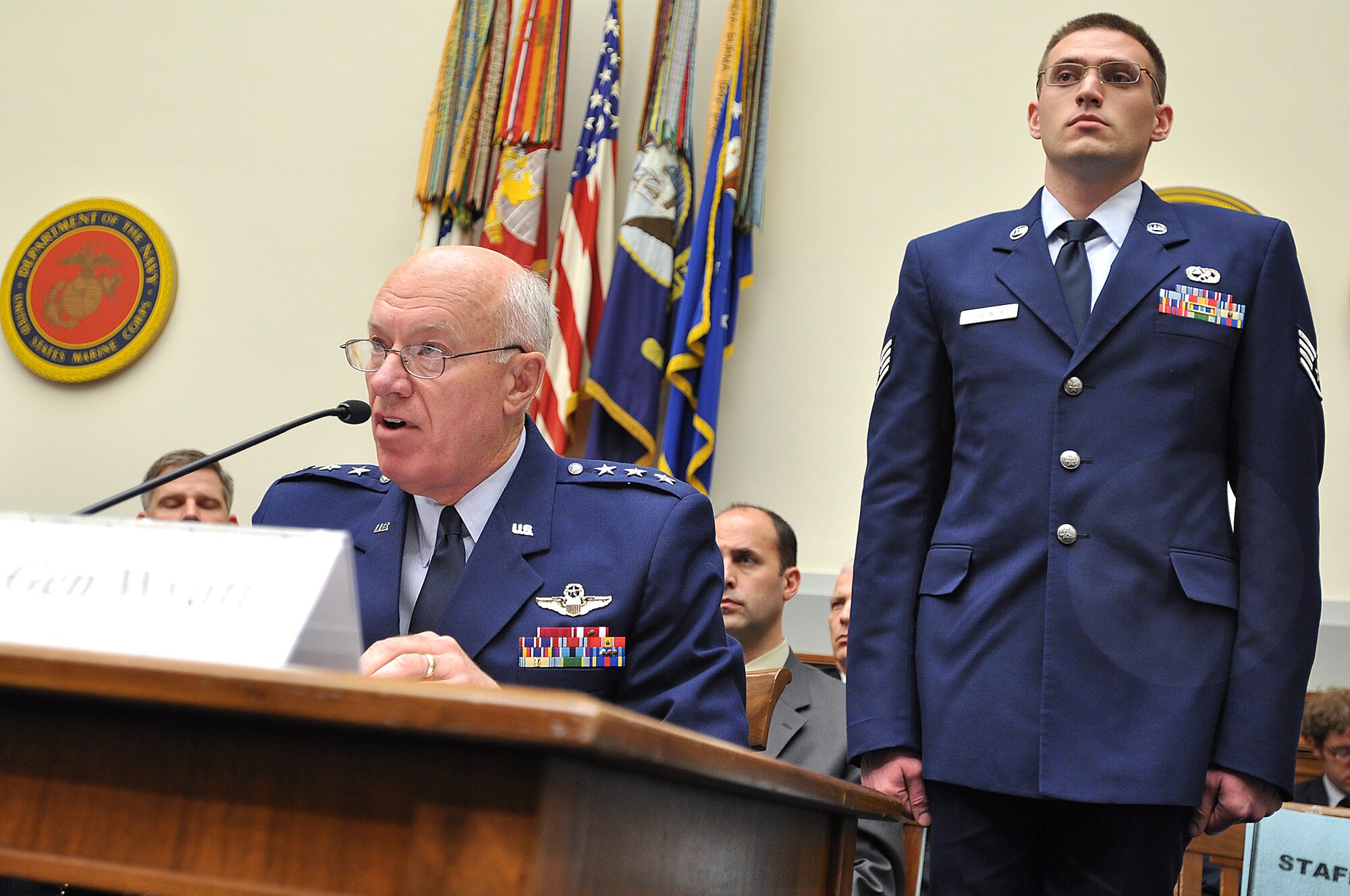 Staff Sgt. Weston Chadwick, 115th Aircraft Maintenance Squadron, stands behind Lt. Gen. Harry Wyatt, the Director of the Air National Guard, at an Armed Services House Committee that addressed the Air Sovereignty Alert Mission. (Photo: Courtesy)