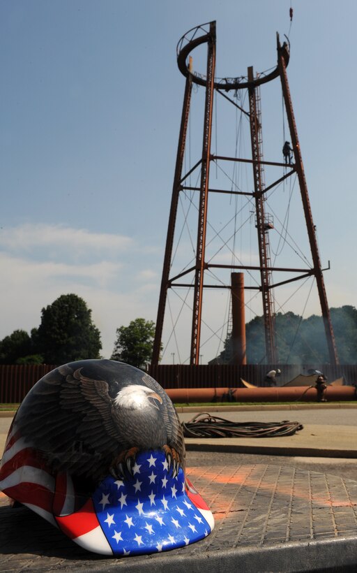 LANGLEY AIR FORCE BASE, Va. -- Contractors nearly have the water tower next to senior non-commissioned officer housing taken down June 7.   This water tower was built in 1930 and has not been in use since 2004.  (U.S. Air Force photo/Senior Airman Zachary Wolf)

