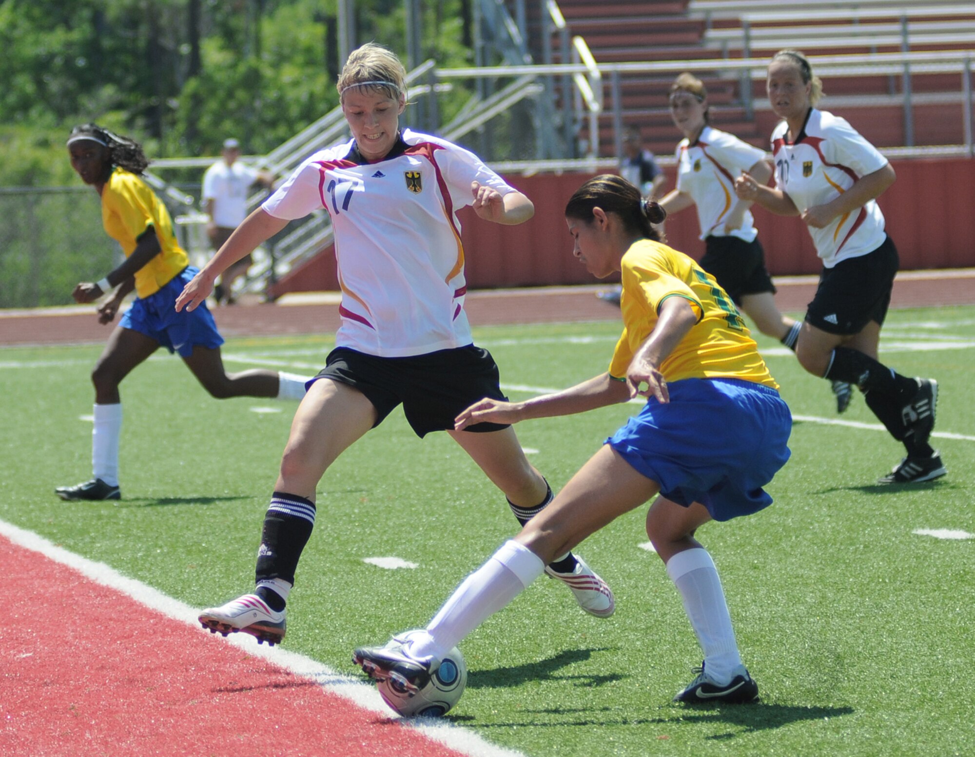Soccer players from Germany and Brazil compete during the 5th Counseil Du International Sports Militaire Women's Soccer Championship at Biloxi High School Stadium June 7 in Mississippi. The CISM tournament, hosted by officials from Keesler Air Force Base, Miss., includes teams from Brazil, Canada, France, Germany, The Netherlands, South Korea and the United States. (U.S. Air Force photo/Kemberly Groue) 
