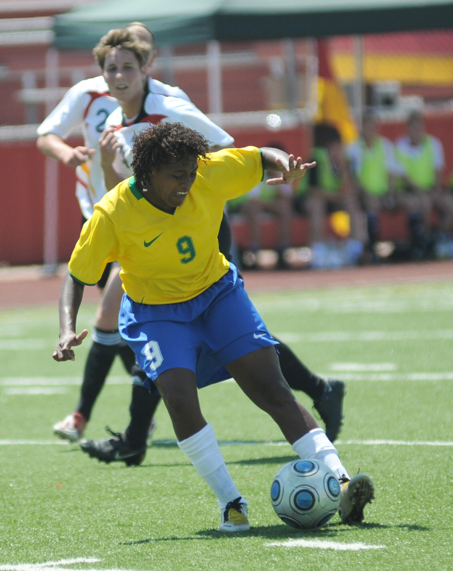 Soccer players from Germany and Brazil compete during the 5th Counseil Du International Sports Militaire Women's Soccer Championship at Biloxi High School Stadium June 7 in Mississippi. The CISM tournament, hosted by officials from Keesler Air Force Base, Miss., includes teams from Brazil, Canada, France, Germany, The Netherlands, South Korea and the United States. (U.S. Air Force photo/Kemberly Groue) 
