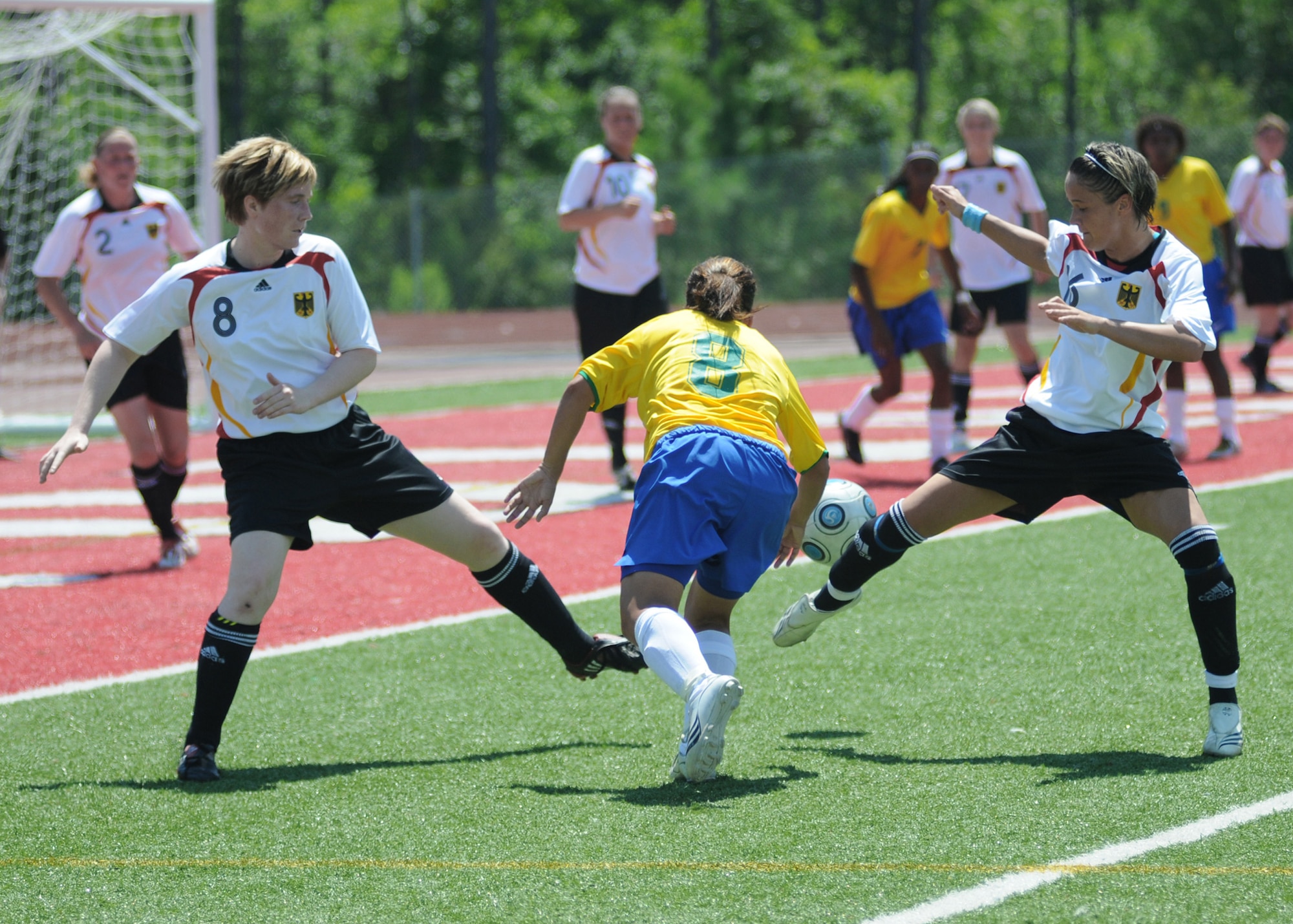 Soccer players from Germany and Brazil compete during the 5th Counseil Du International Sports Militaire Women's Soccer Championship at Biloxi High School Stadium June 7 in Mississippi. The CISM tournament, hosted by officials from Keesler Air Force Base, Miss., includes teams from Brazil, Canada, France, Germany, The Netherlands, South Korea and the United States. (U.S. Air Force photo/Kemberly Groue) 
