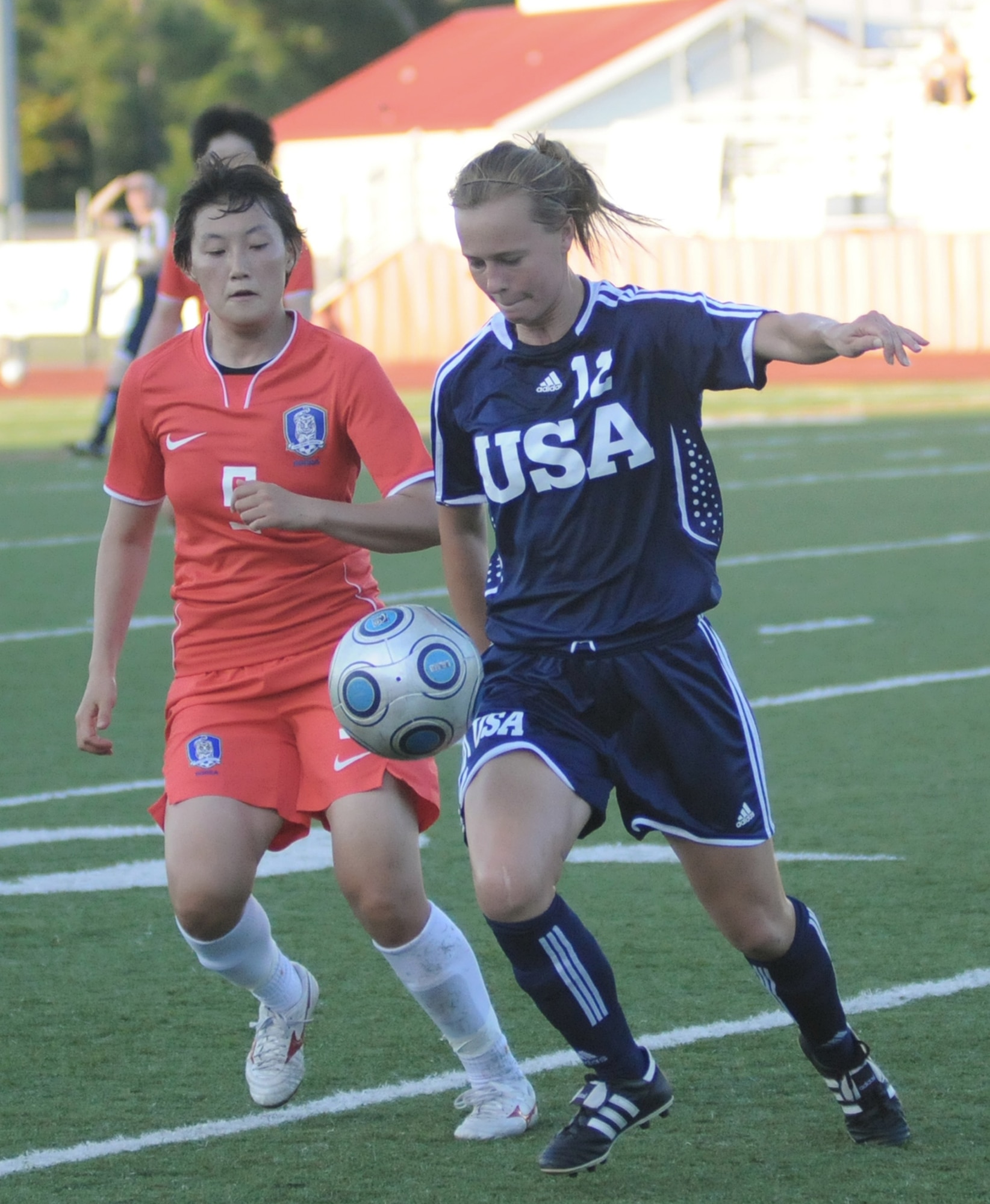 Soccer players from the United States and South Korea compete during the 5th Counseil Du International Sports Militaire Women's Soccer Championship at Biloxi High School Stadium June 7 in Mississippi. The CISM tournament, hosted by officials from Keesler Air Force Base, Miss., includes teams from Brazil, Canada, France, Germany, The Netherlands, South Korea and the United States. Matches are scheduled June 6 through 13, with the Gold Match June 13 at 2 p.m. (U.S. Air Force photo/Kemberly Groue) 
