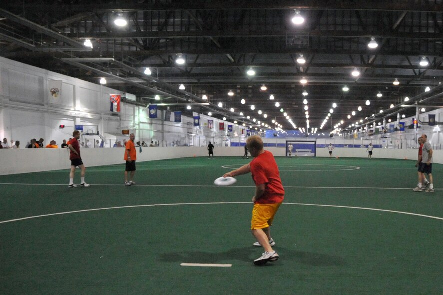 OFFUTT AIR FORCE BASE, Neb. -- Eric Collins, Air Force Weather Agency, pulls the frisbee to start an ultimate Frisbee game in the Offutt Field House during Offutt Sports Day June 5. All base agencies competed in activities including tug-of-war, 110-yard dash and ultimate frisbee. Trophies were presented to the top 3 points gaining units from the combined events during the Offutt Appreciation Day picnic at the Base Lake later that day. U. S. Air Force photo by Jeff W. Gates
