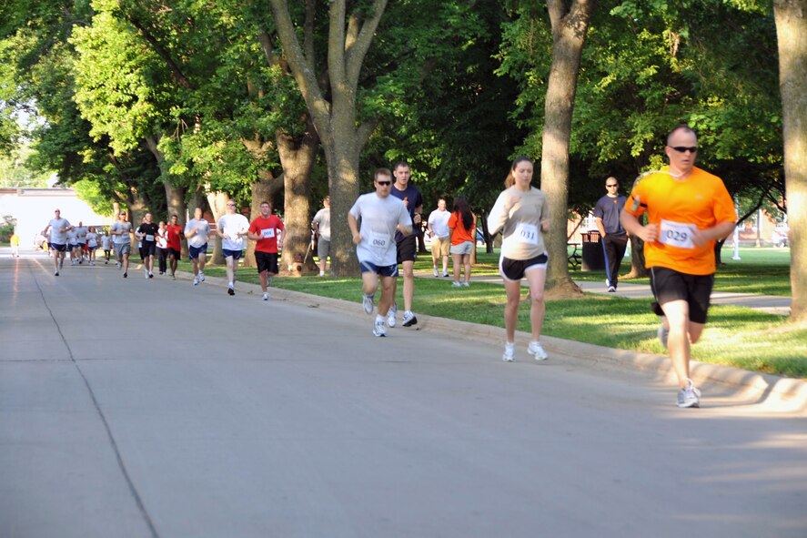 OFFUTT AIR FORCE BASE, Neb. -- Runners complete a 5k during one of the Offutt Sports Day activities June 5. The day included tug-of-war, 110-yard dash and ultimate frisbee. Trophies were presented to the top 3 units to finish from the combined event.U.S. Air Force photo by Jeff W. Gates