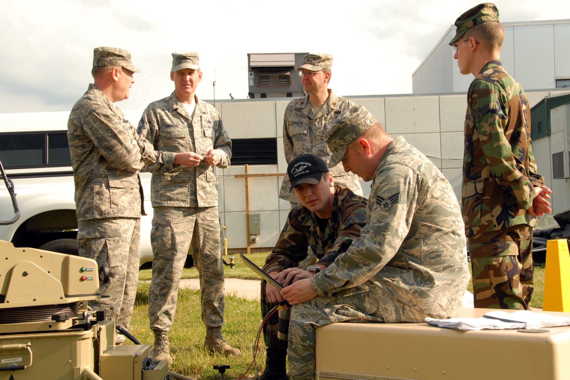 174th Fighter Wing, New York Air National Guard, Commander Col. Kevin W. Bradley meets with members of the 174th Fighter Wing's Communications Flight at Hancock Field in Syracuse, NY, on June 7, 2009. Bradley was being updated on the abilities of the Joint Incident Site Communications Capability system (JISCC). (US Air Force photo courtesy of the 174th Fighter Wing Public Affairs Office/Released)