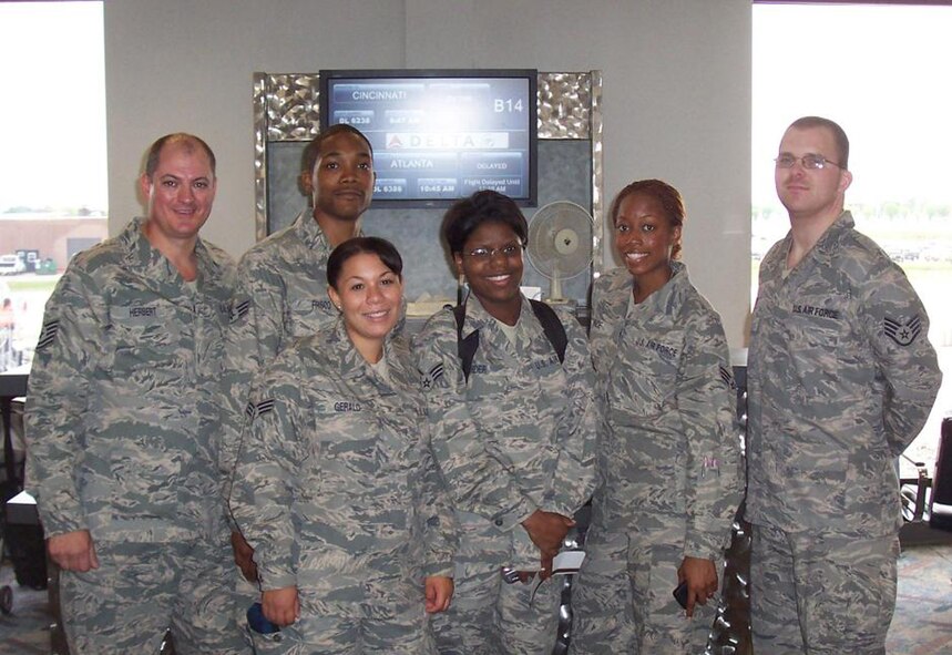 WRIGHT-PATTERSON AIR FORCE BASE, Ohio – Six reservists from the 445th Services Flight wait at the Dayton International Airport for their flight as they prepare to deploy to Joint Base Balad, Iraq, May 25. From left to right; Tech. Sgt. Scott Herbert, Senior Airman Joey Frisco, Senior Airman Nastasskia Gerald, Senior Airman Nicole Shider, Senior Airman Angela Prince and Staff Sgt. Seth Webber.  (Air Force photo/Senior Master Sgt. Julie Haskell)