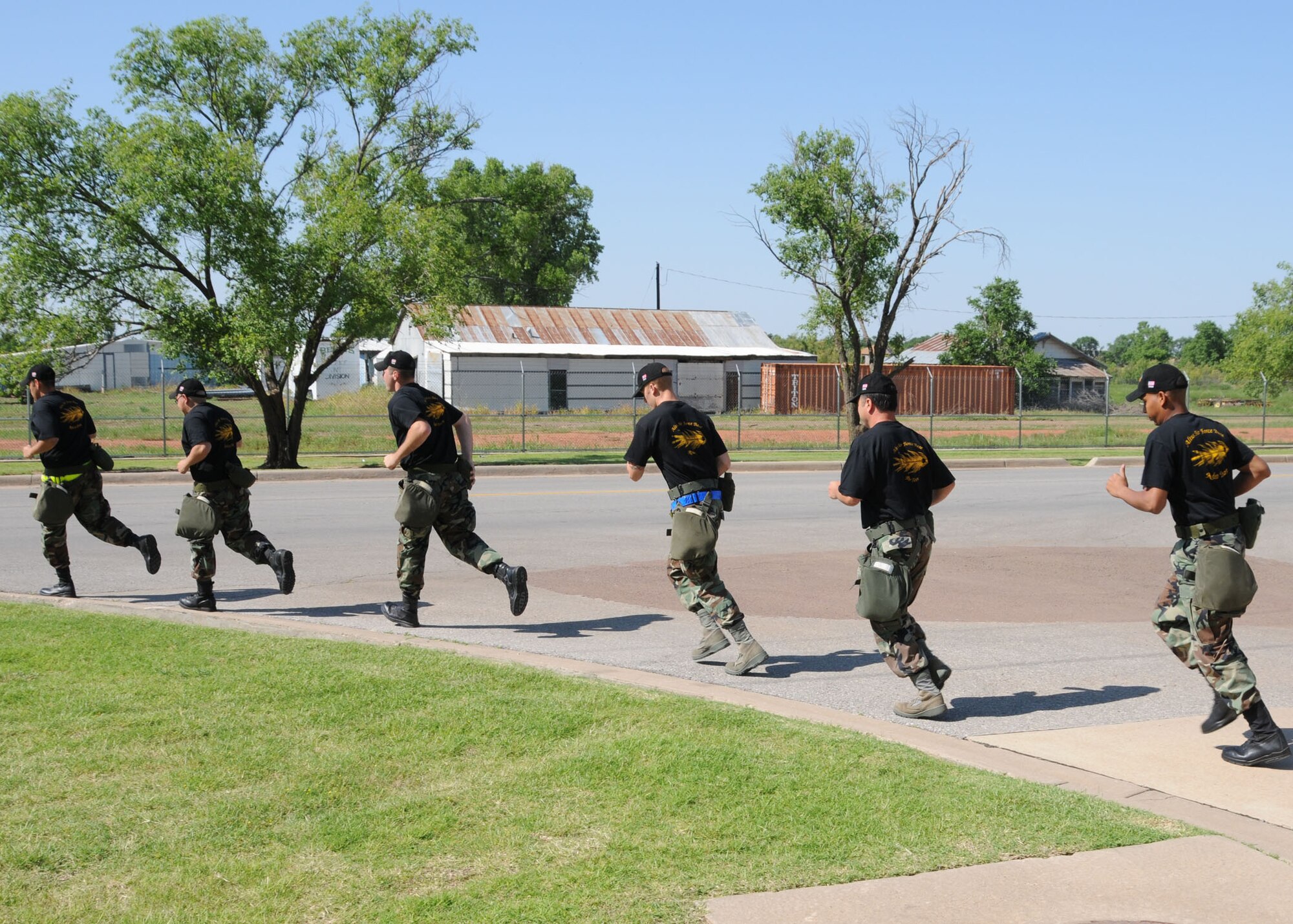 ALTUS AIR FORCE BASE, Okla. -- The six members of the 97th Logistics Readiness Squadron's Rodeo Team start off on a group practice run. The team of aerial delivery personnel run as a group to improve teamwork and physical conditioning for the four mile Rodeo challenge course. (U.S. Air Force photo by Airman 1st Class Tiffany M. Deuel)
