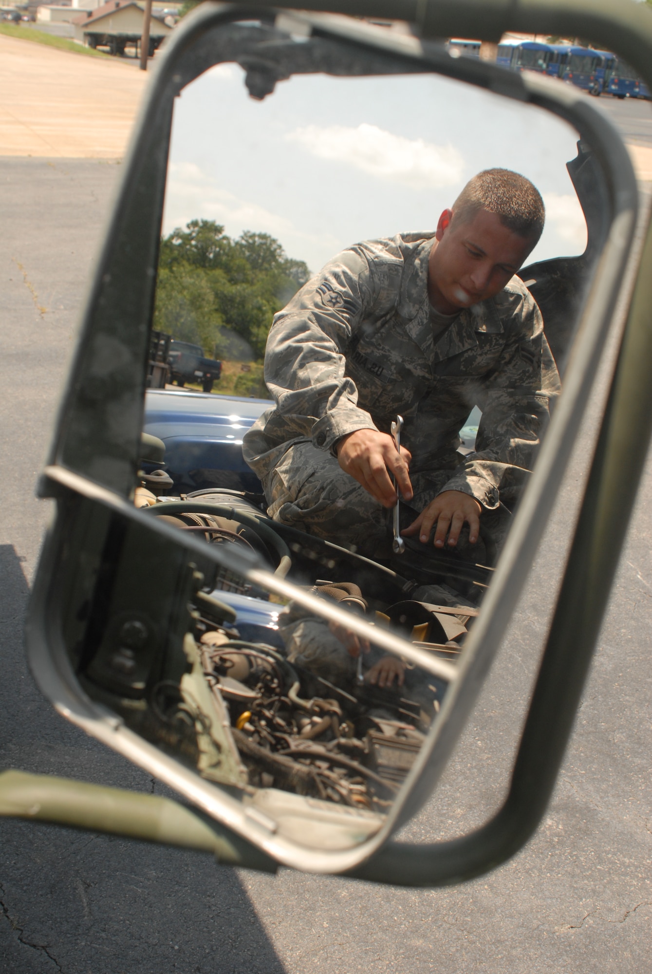 Airman 1st Class Bryan Wails, a 19th Logistics Readiness Squadron Vehicle Maintenance Journeyman, adjusts the tensioner pulley on a Hum-V to remove a belt at Little Rock Air Force Base, Ark. June 8, 2009. The 19th LRS’s small vehicle maintenance team broke a record by sustaining a 96.2 percent mission capable rate for the month of March, the best mark seen in 20 years and best in Air Mobility Command. (U.S. Air Force photo by Senior Airman Nathan Allen)