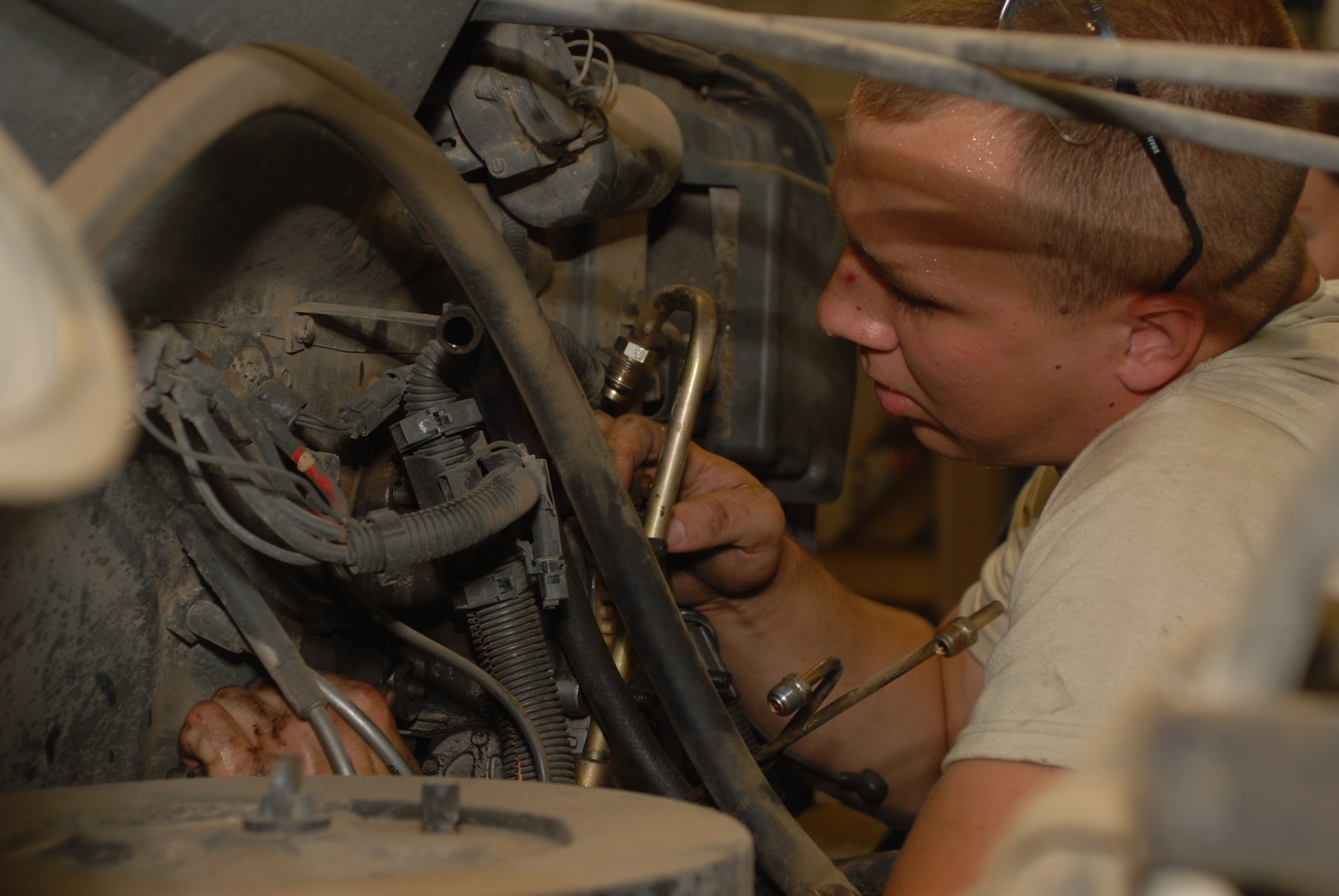Airman 1st Class Cade Browning, a 19th Logistics Readiness Squadron special purpose journeyman, removes hydraulic brake booster from a tymco sweeper at Little Rock Air Force Base, Ark. June 8, 2009. The 19th LRS’s small vehicle maintenance team broke a record by sustaining a 96.2 percent mission capable rate for the month of March, the best mark seen in 20 years and best in Air Mobility Command. (U.S. Air Force photo by Senior Airman Nathan Allen)