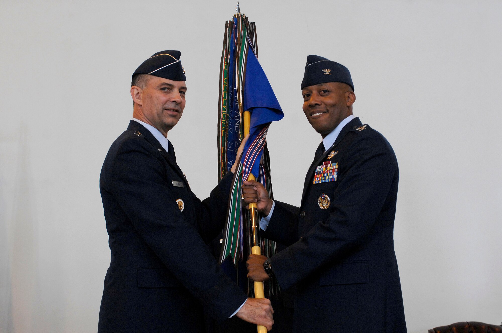 Col. Charles Q. Brown Jr. accepts the guidon and command of the 31st Fighter Wing from Maj. Gen. Mark Zamzow, 3rd Air Force vice commander, during a change of command ceremony here June 9.  Colonel Brown has been selected for promotion to brigadier general.  (U.S. Air Force photo/Airman 1st Class Ashley Wood)