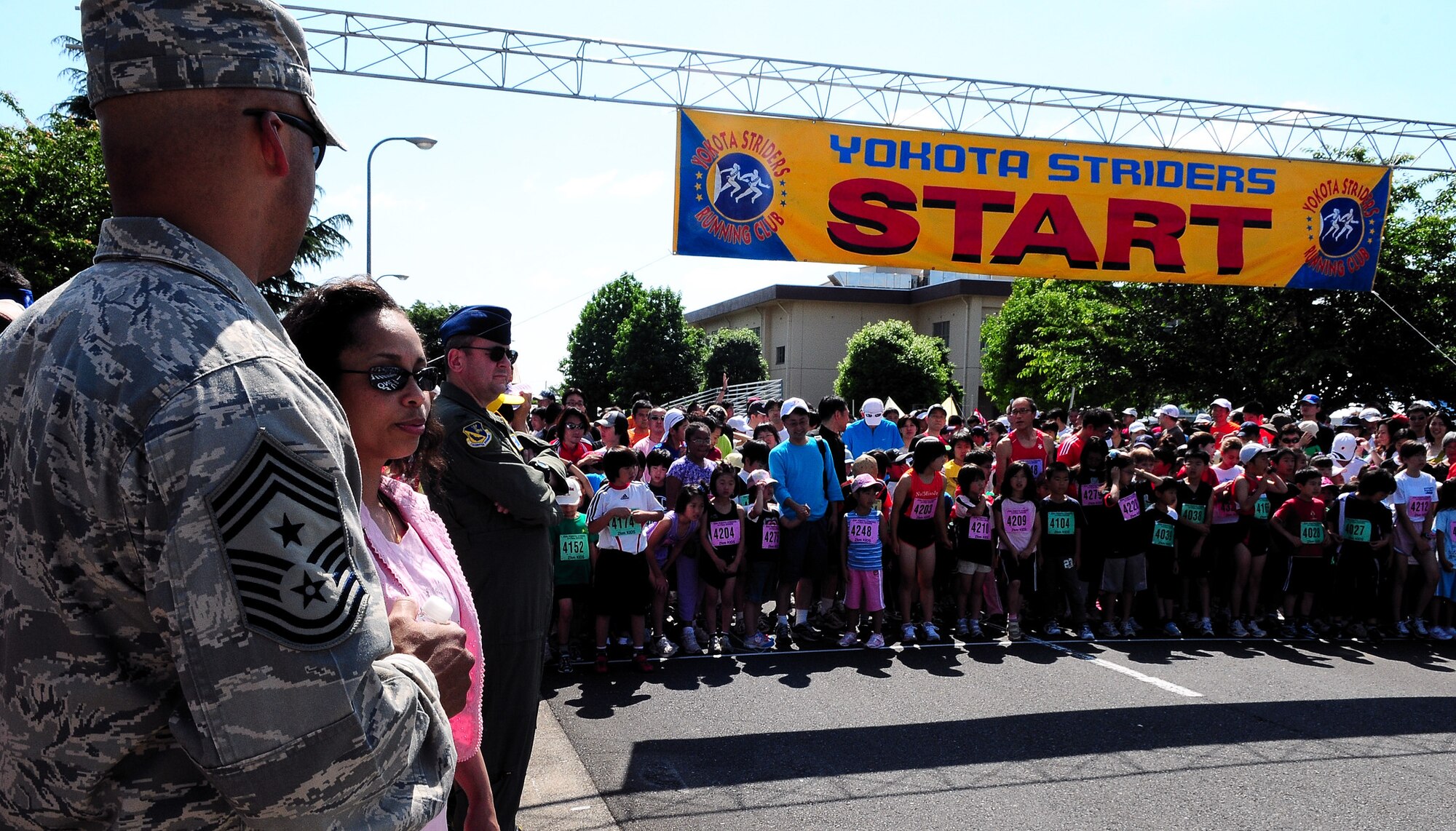 YOKOTA AIR BASE, Japan –- Children anxiously await the start of the 2K race during the 25th Annual Yokota Striders Ekiden, June 7. This race was one of three races held that day. More than 9,800 people attended the event this year. (Air Force photo/Airman 1st Class Michael Dillon)