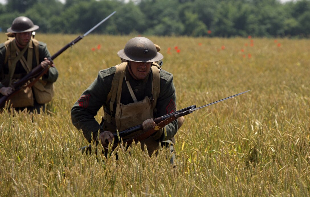 Marines from Marine Corps Base Quantico, Va., walk through a wheat field about 30 miles from Quantico as a part of the National Museum of the Marine Corps reenactment video of the Battle of Belleau Wood June 9. Forty Marines were selected for the video after an audition process.