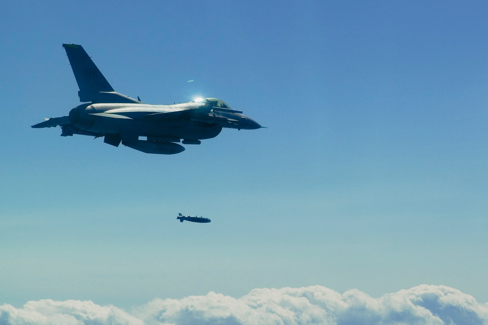 MISAWA AIR BASE, Japan -- An F-16 Fighting Falcon drops an inert GBU-38 on Draughon Range May 13, 2009. This was the first time a joint direct attack munition was used on the range. (U.S. Air Force photo by 1st Lt. Ryan Cross)