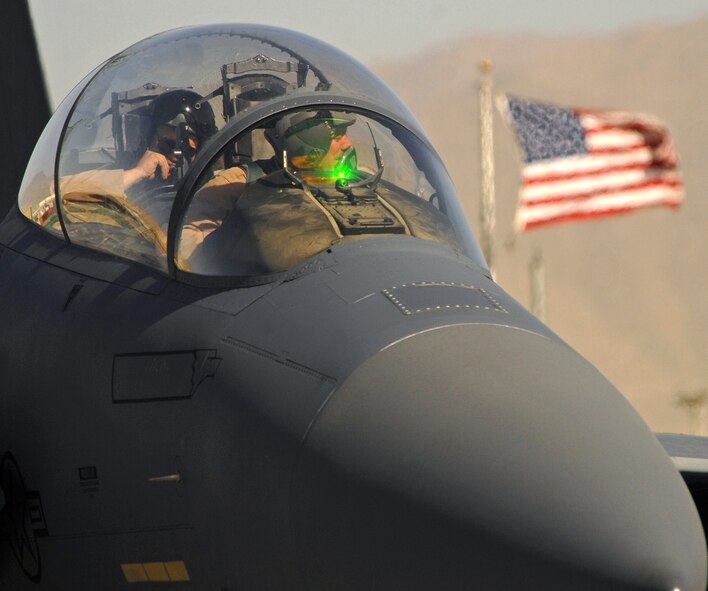 An F-15E Strike Eagle pilot and weapon system operator from the 336th Expeditionary Fighter Squadron at Bagram Airfield, Afghanistan, prepare to take off June 9 for a close-air-support mission. In May, aircrews from the 336th EFS and the 74th EFS, who fly A-10 Thunderbolt IIs, together logged a total of more than 5,000 combat flight hours over Afghanistan. The aircraft assigned here provide close-air support and airborne intelligence, surveillance and reconnaissance for American and coalition ground troops. (Air Force/Staff Sgt. Jason Lake)