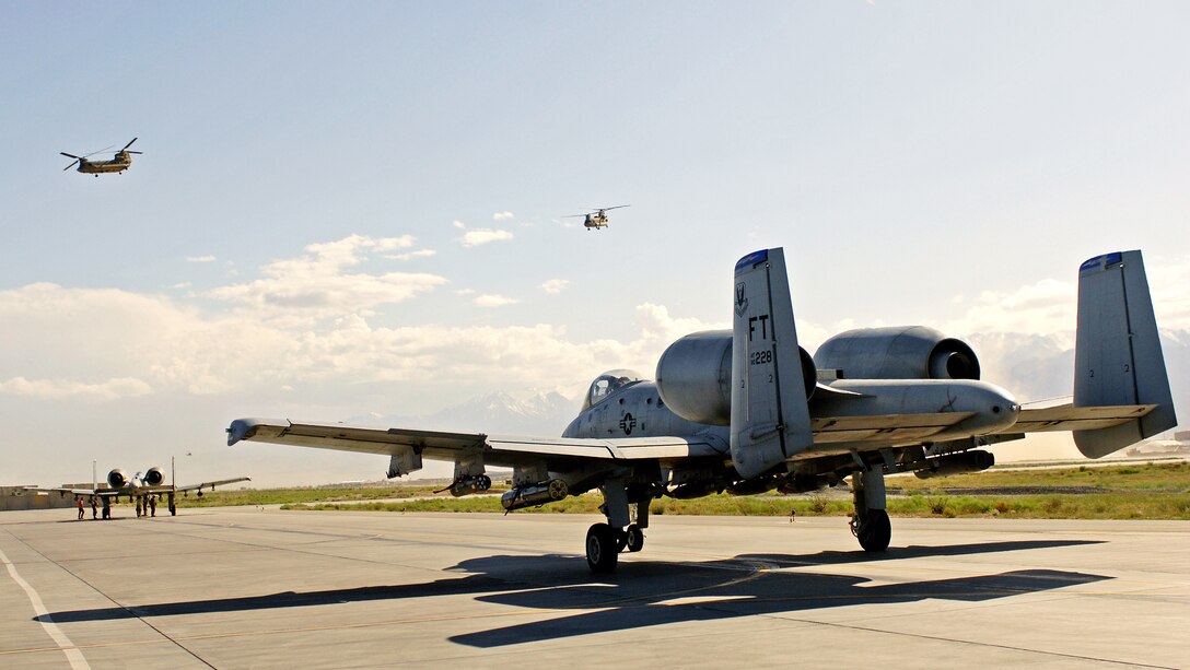 A pair of A-10 Thunderbolt IIs from the 74th Expeditionary Fighter Squadron at Bagram Airfield, Afghanistan, get their final weapons check before taking off on a close-air-support mission June 9.  In May, aircrews from the 74th EFS and the 336th EFS, who fly F-15E Strike Eagles, together logged a total of more than 5,000 combat flight hours over Afghanistan. The aircraft assigned here provide close-air support and airborne intelligence, surveillance and reconnaissance for American and coalition ground troops. (Air Force/Staff Sgt. Jason Lake)