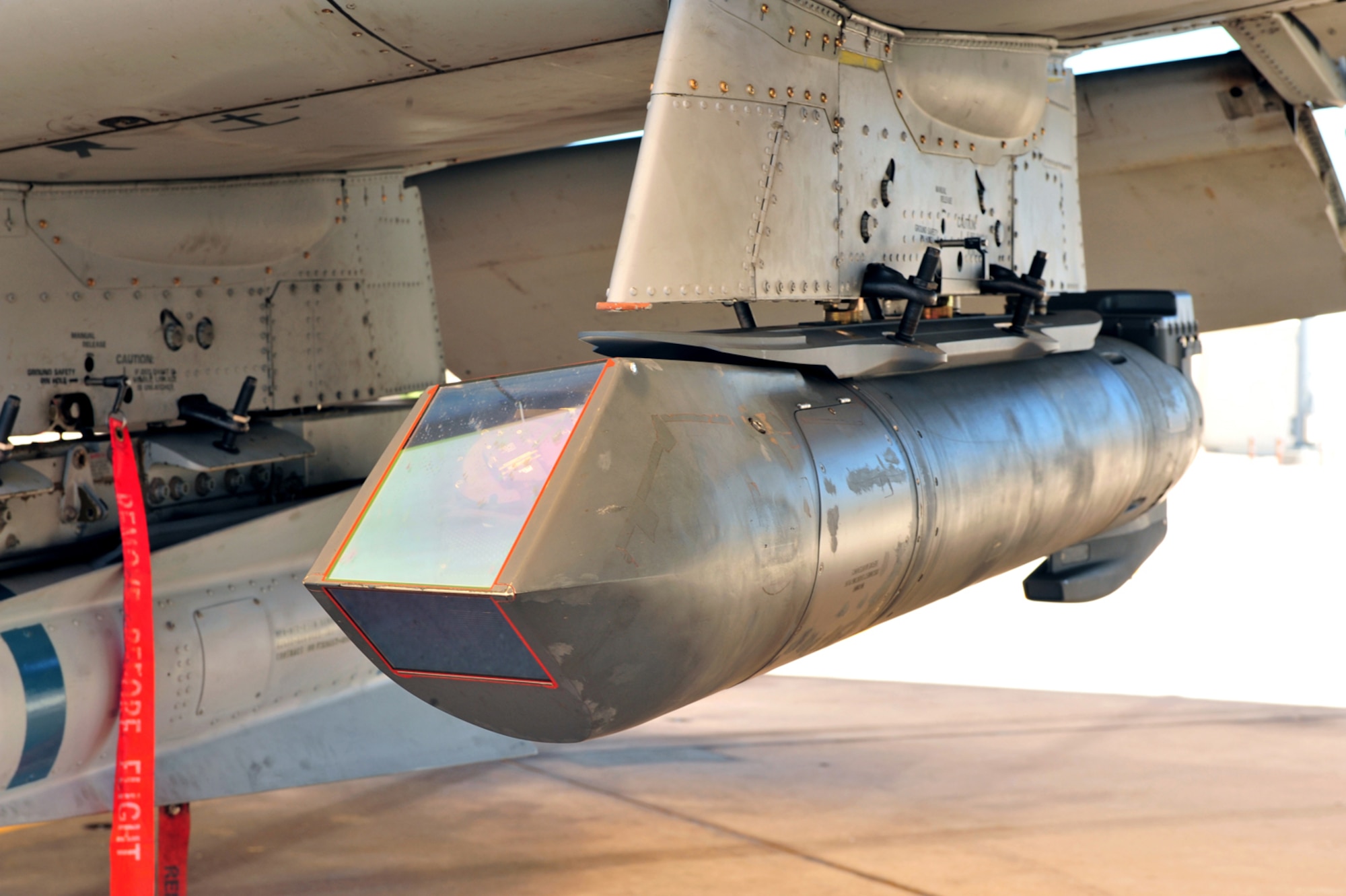 Lockheed Martin's Sniper Advanced Targeting Pod, which is used for long-range, positive identification of targets, is seen here on the left wing of a D-M A-10C. Lockheed Martin recently completed a Sniper ATP site activation here at D-M. (U.S. Air Force photo/Senior Airman Noah Johnson)
