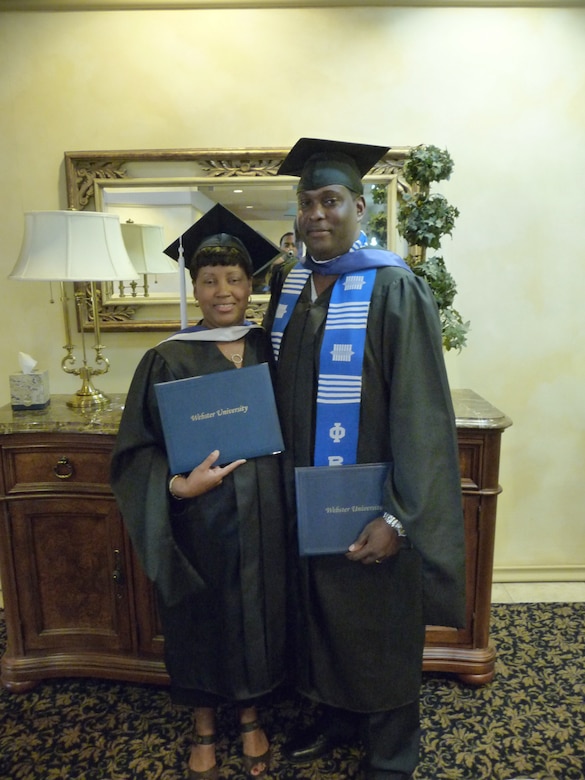 Natasha Green (left), 95th Force Support Squadron Human Resource specialist, and her husband, Kenneth Green, 95th Communications Group planning and implementation computer scientist, graduated during a ceremony at Club Muroc June 6. Mrs. Green graduated with a Master of Arts in Management and Leadership at Webster University-Edwards campus. Mrs. Green was diagnosed with early stage of breast cancer during her first year in graduate school and is now cancer-free. (Courtesy photo)