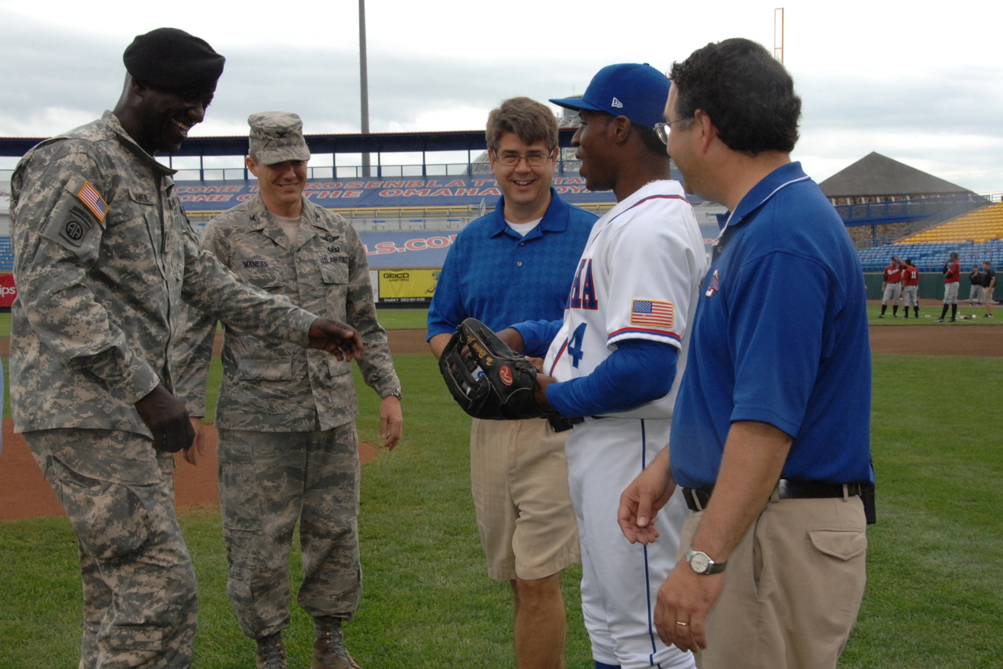 OFFUTT AIR FORCE BASE, Neb. -- Maj. Gen. Abraham X. Turner, chief of staff of U.S. Strategic Command and Col. Robert L. Maness, 55th Wing vice commander, meet with members of the Omaha Royals organziation before the Omaha Royals Military Appreciation Game at Rosenblatt Stadium June 7. U.S. Air Force photo by Kendra Williams