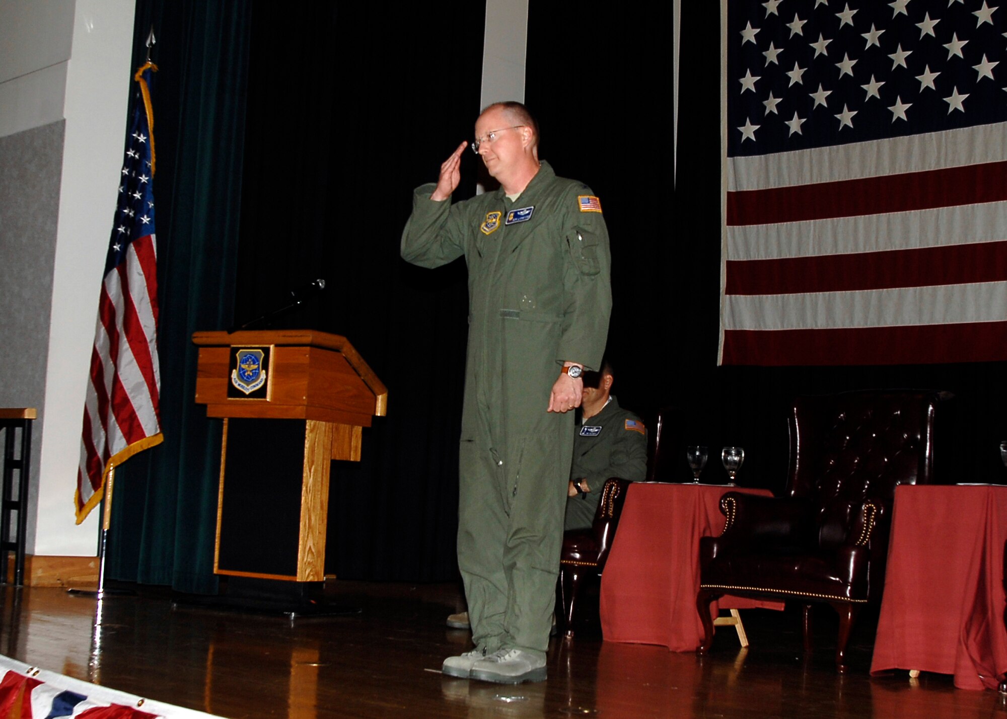 MCCONNELL AIR FORCE BASE, Kan. -- Col. Billy Langford, 22nd Operations Group commander, returns the first salute to the proud men and woman of the operations squadron here at the Robert J. Dole Community Center ballroom, June 5. Once the gaining commander takes command of the organization, the commander returns the salute. (Photo by Senior Airman Anthony Mejia)