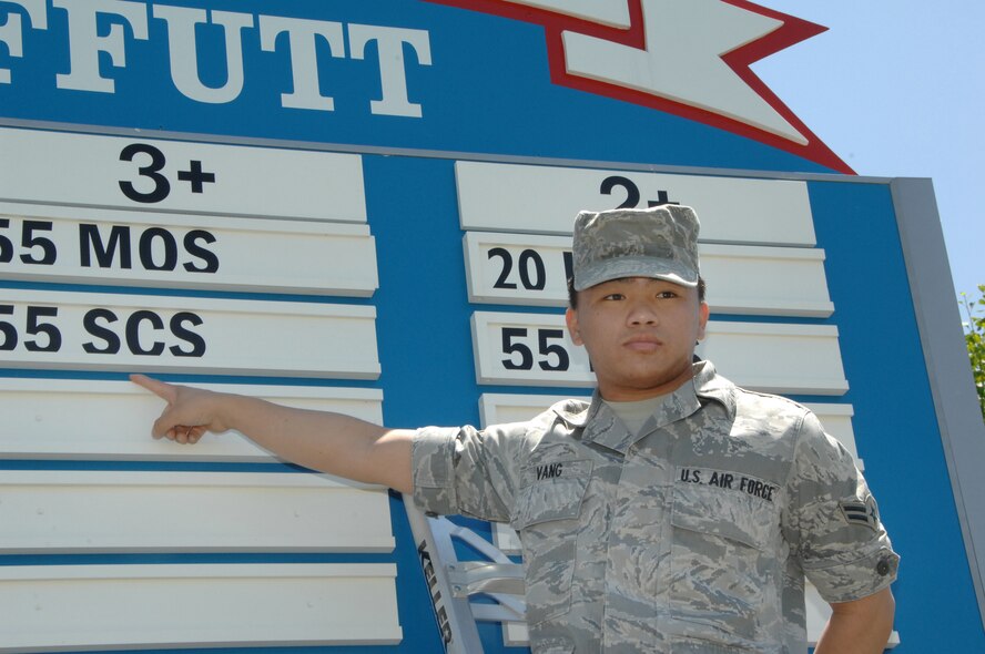 OFFUTT AIR FORCE BASE, Neb. -- Airman 1st Class Tony Z.S. Vang, a Milstar maintenance apprentice with the 55th Strategic Communications Squadron, points to the 55th SCS placard on the DUI awareness board inside the Kenney Gate June 4. A few moments earlier, Airmen from the 55th SCS moved the units placard from the two year to the three year mark. The 55th SCS is one of seven units who've been DUI free for three years or more. U.S. Air Force Photo by Mr. D.P. Heard